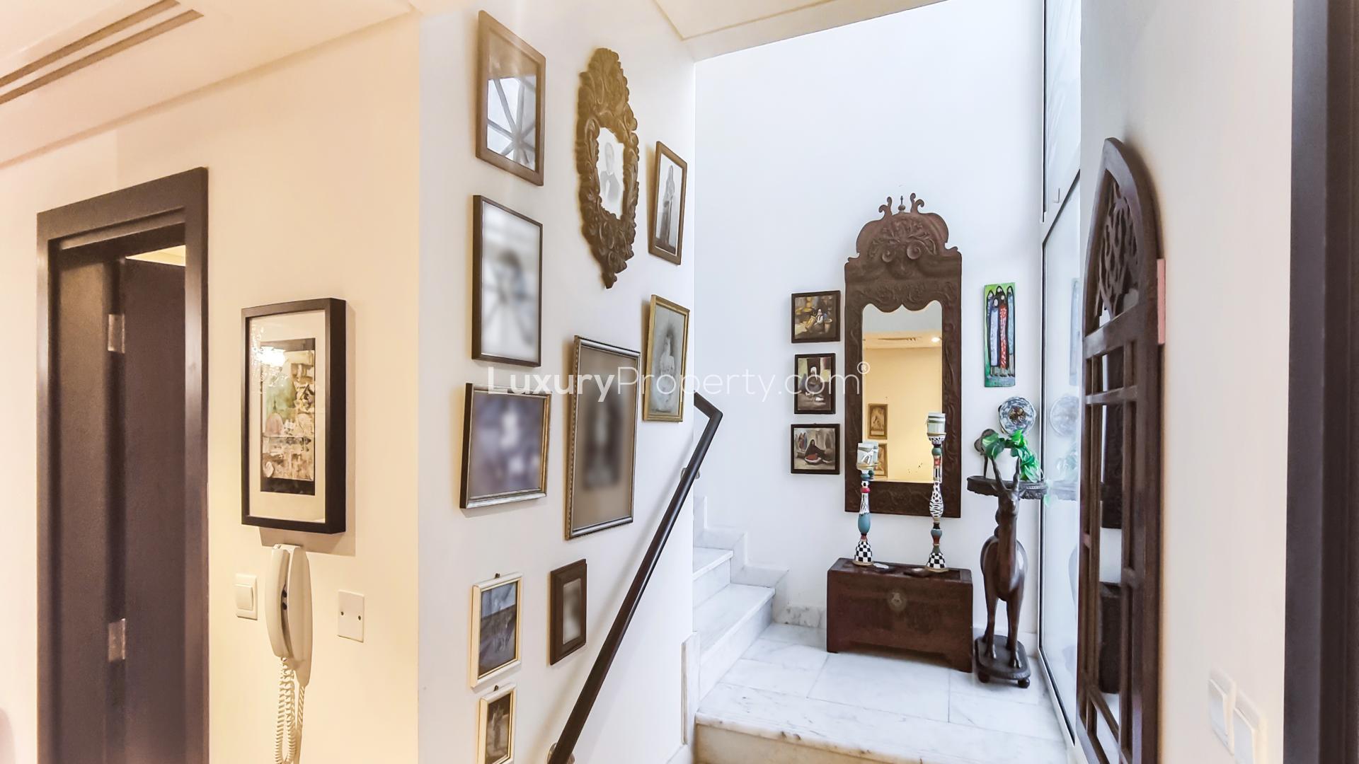 Living room in Mudon townhouse with eclectic decor and chandelier, Arabella Townhouses