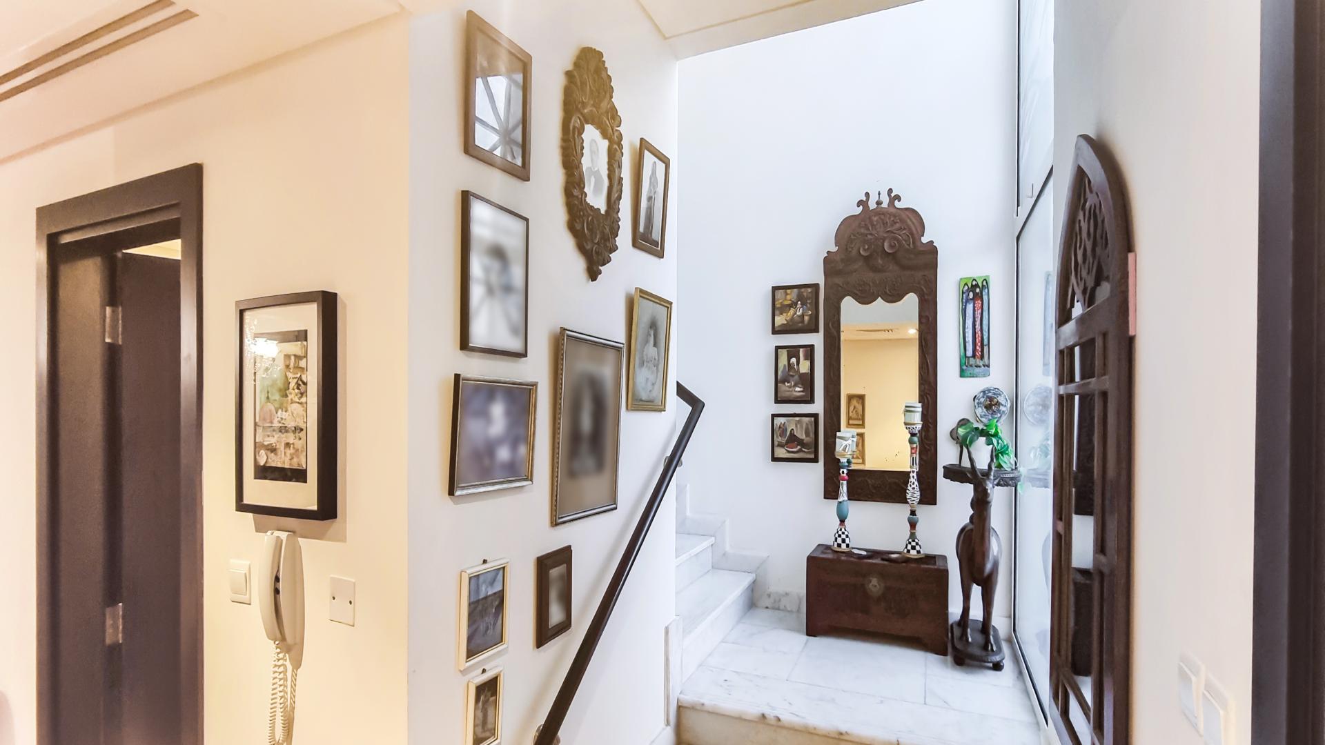 Living room in Mudon townhouse with eclectic decor and chandelier, Arabella Townhouses