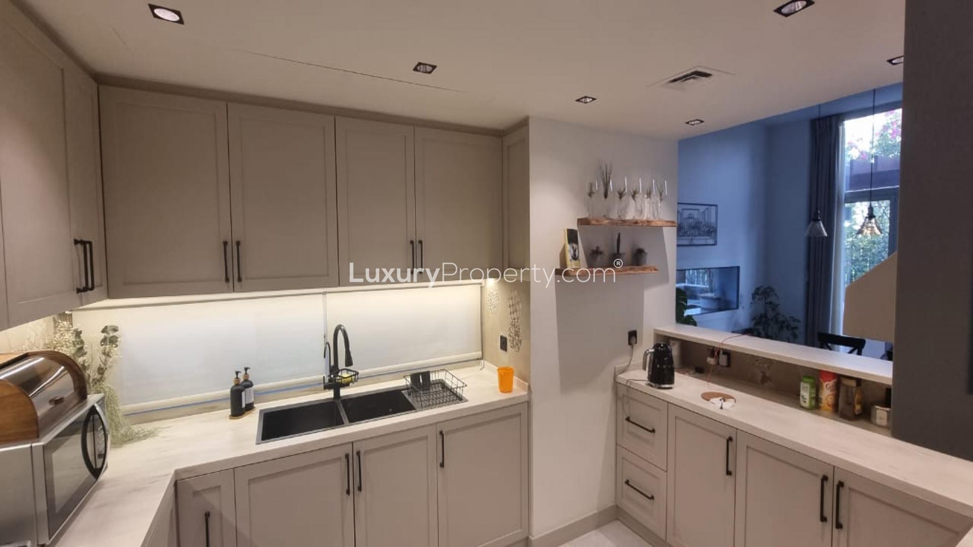 Modern kitchen in 3-bedroom townhouse, Mudon Arabella Townhouses, Dubai, with stylish cabinetry and decor