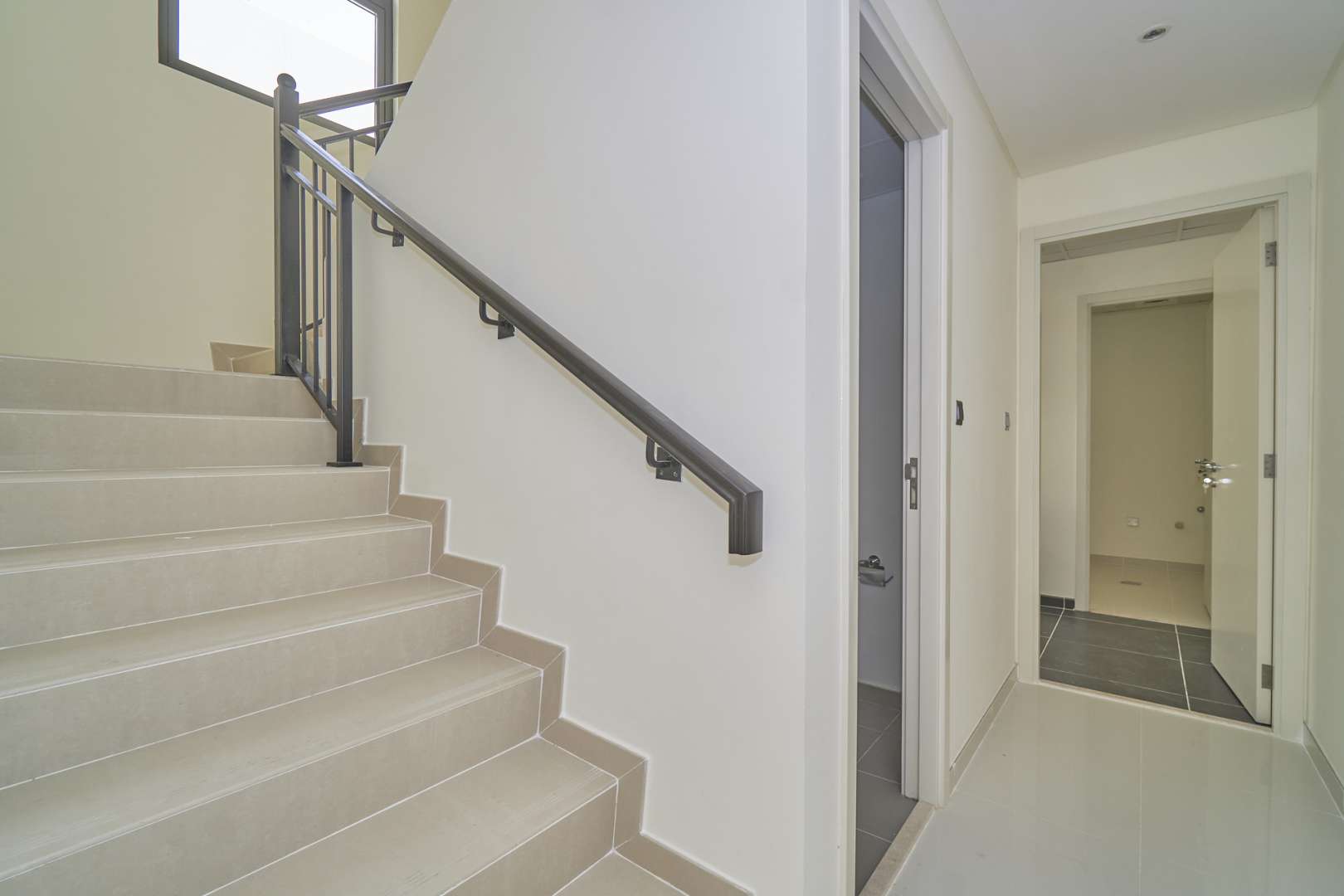 Stylish townhouse exterior in Aster, Damac Hills 2, with modern design and covered parking