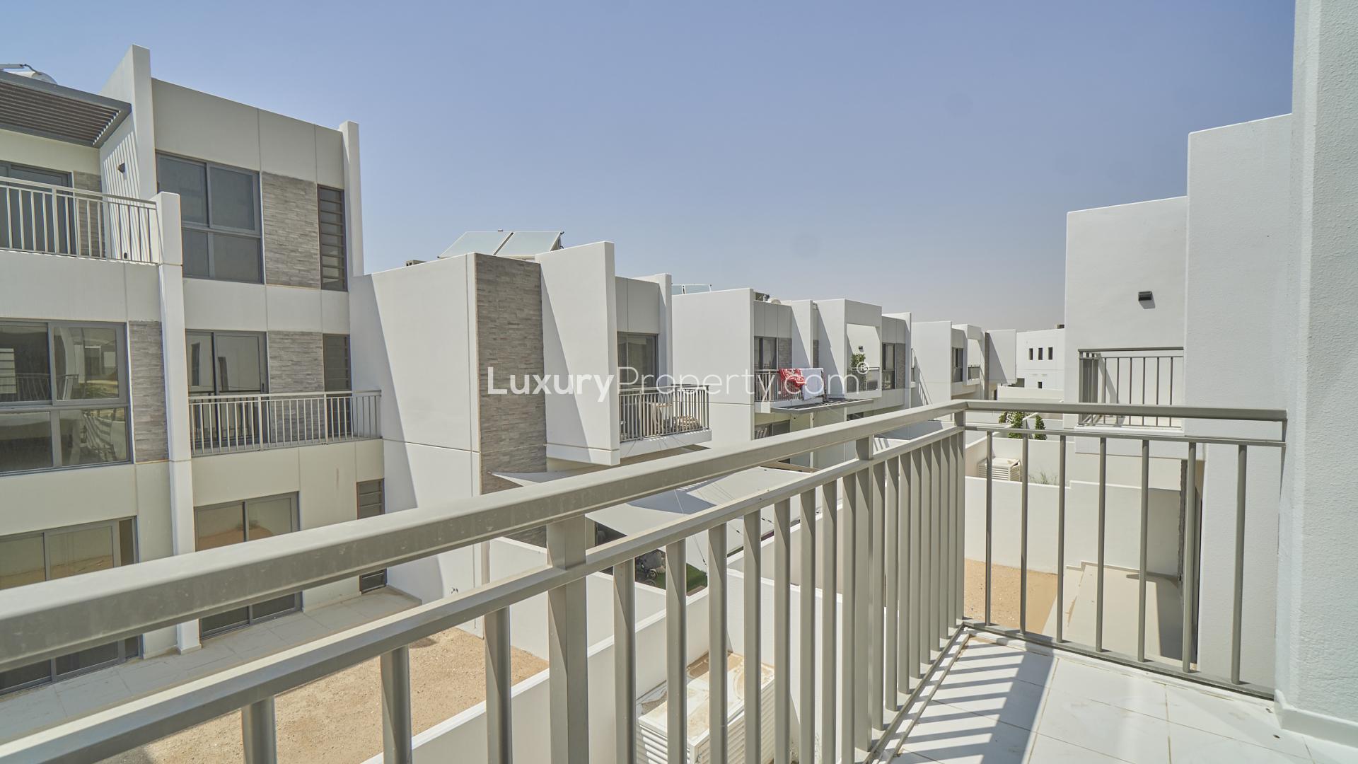 End unit townhouse exterior with patio in Aster, Damac Hills 2, Trixis community