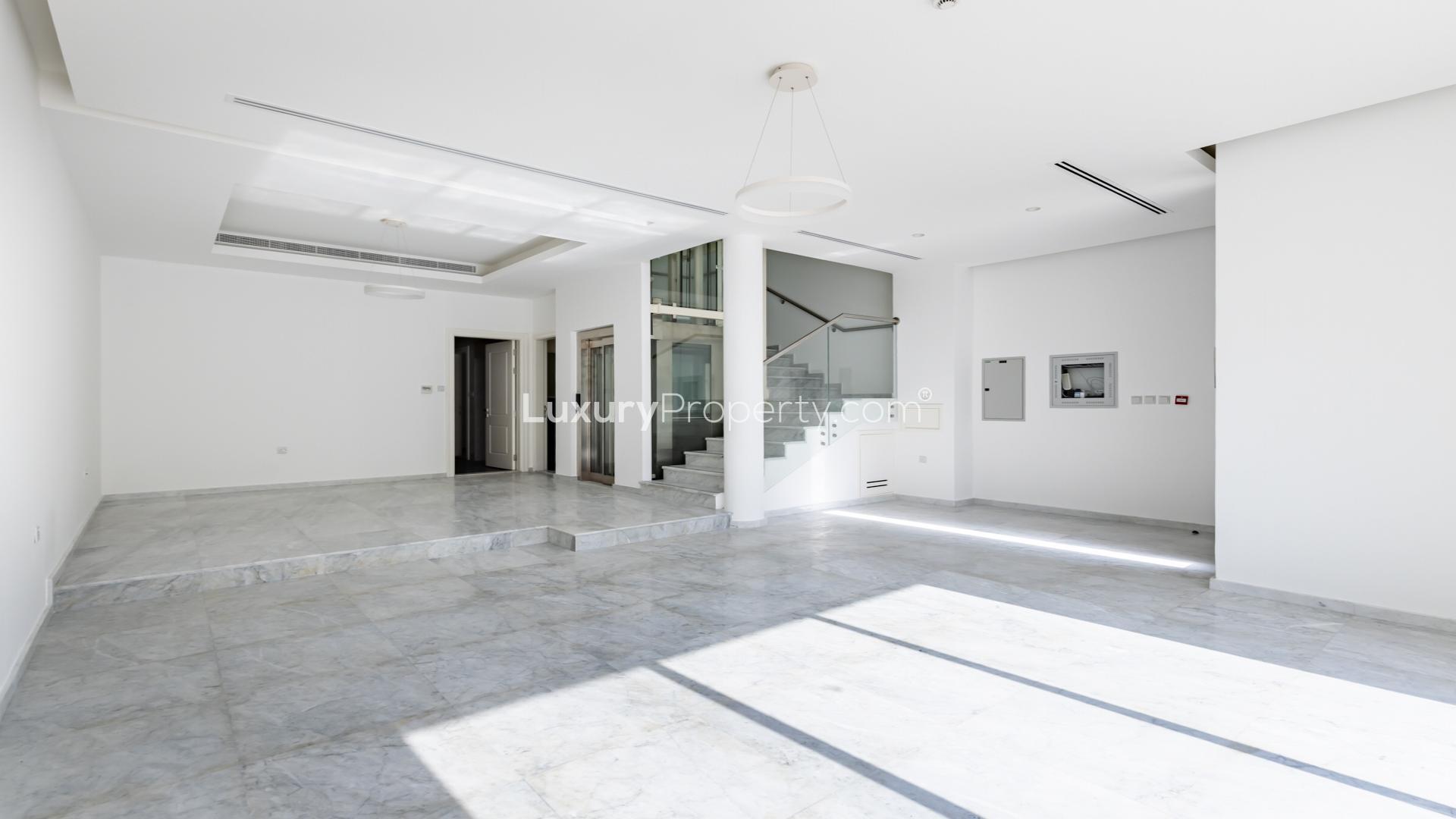 Modern interior with high ceiling and glass balcony in Jumeirah Village Circle townhouse