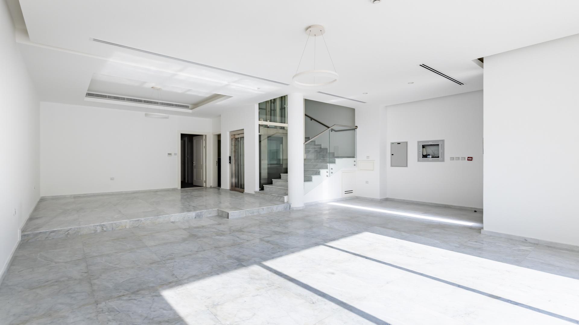 Modern interior with high ceiling and glass balcony in Jumeirah Village Circle townhouse