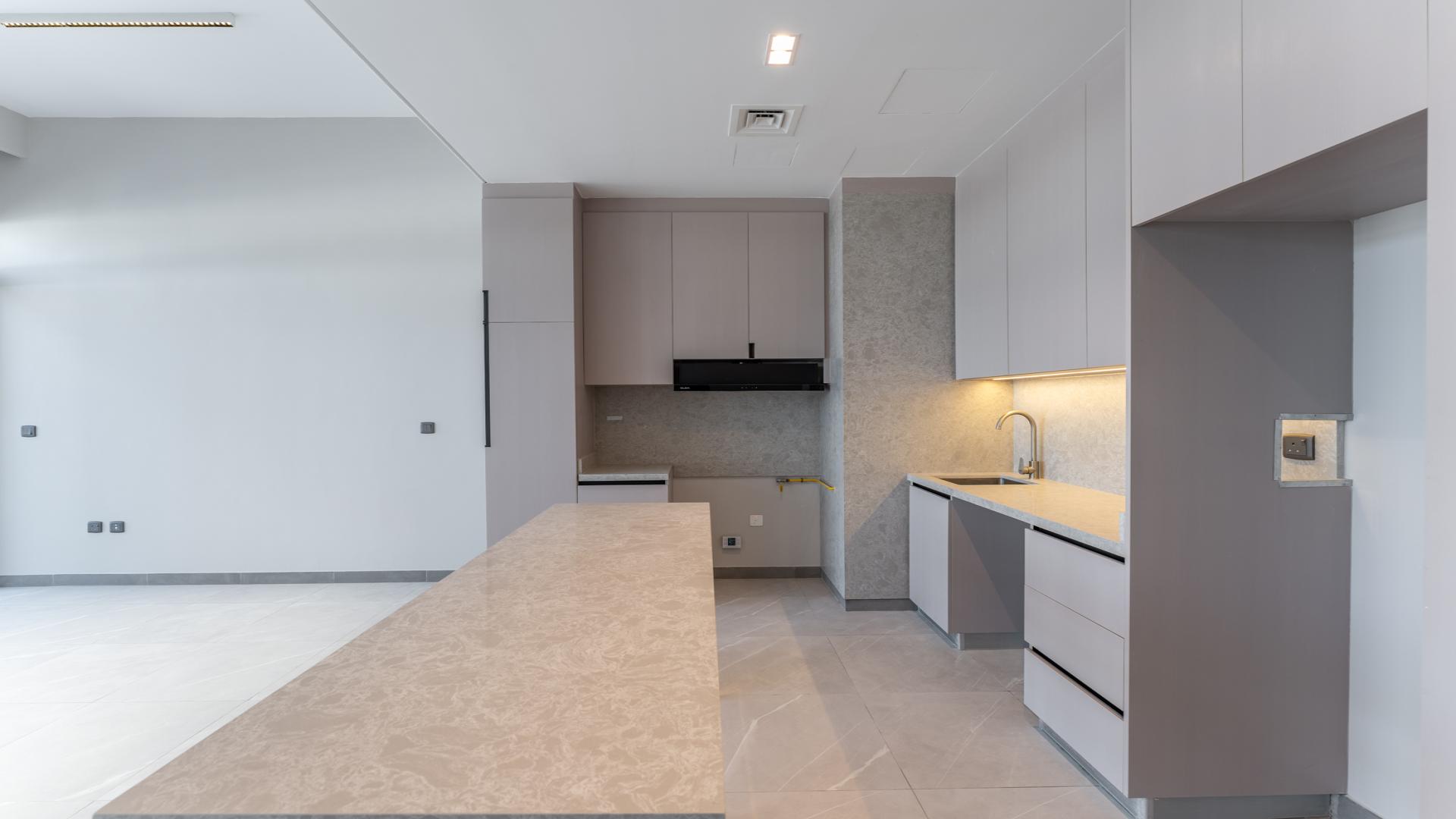 "Spacious modern kitchen in brand-new 3-bedroom townhouse, District 7, Mohammed Bin Rashid City.",Modern kitchen in new 3-bedroom townhouse, District 7, Mohammed Bin Rashid City, for sale