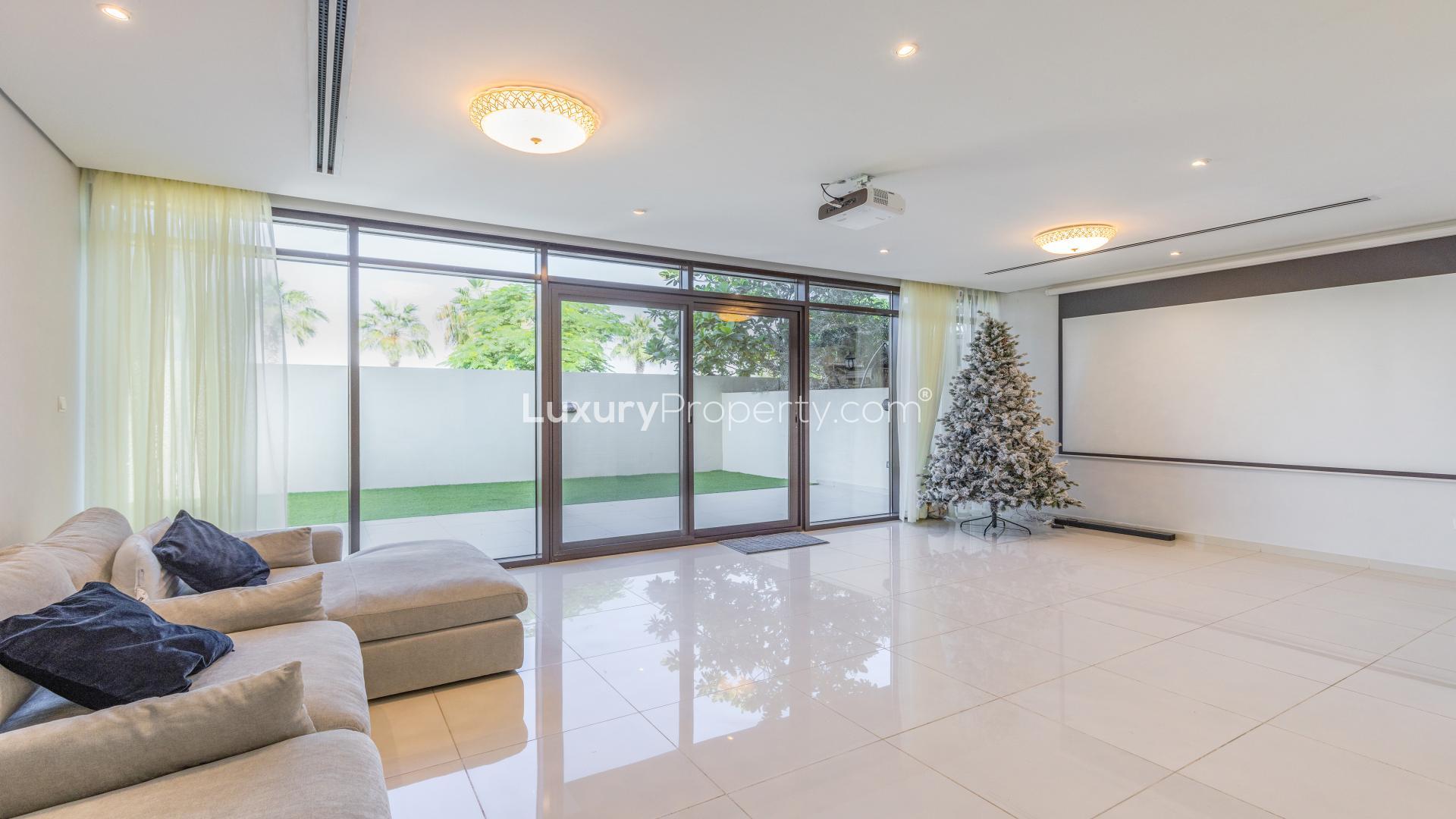 Spacious living room in Brookfield townhouse, large windows, modern decor, Damac Hills property