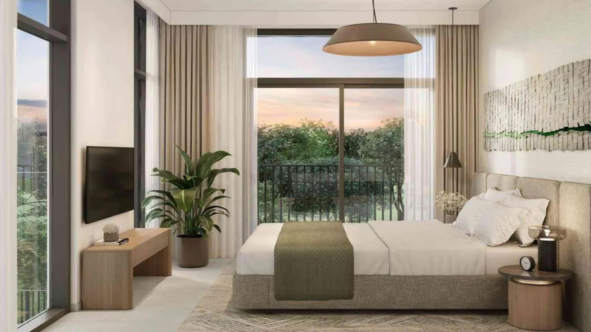 Modern bedroom with large window, garden view in Mudon Al Ranim townhouse, Dubai