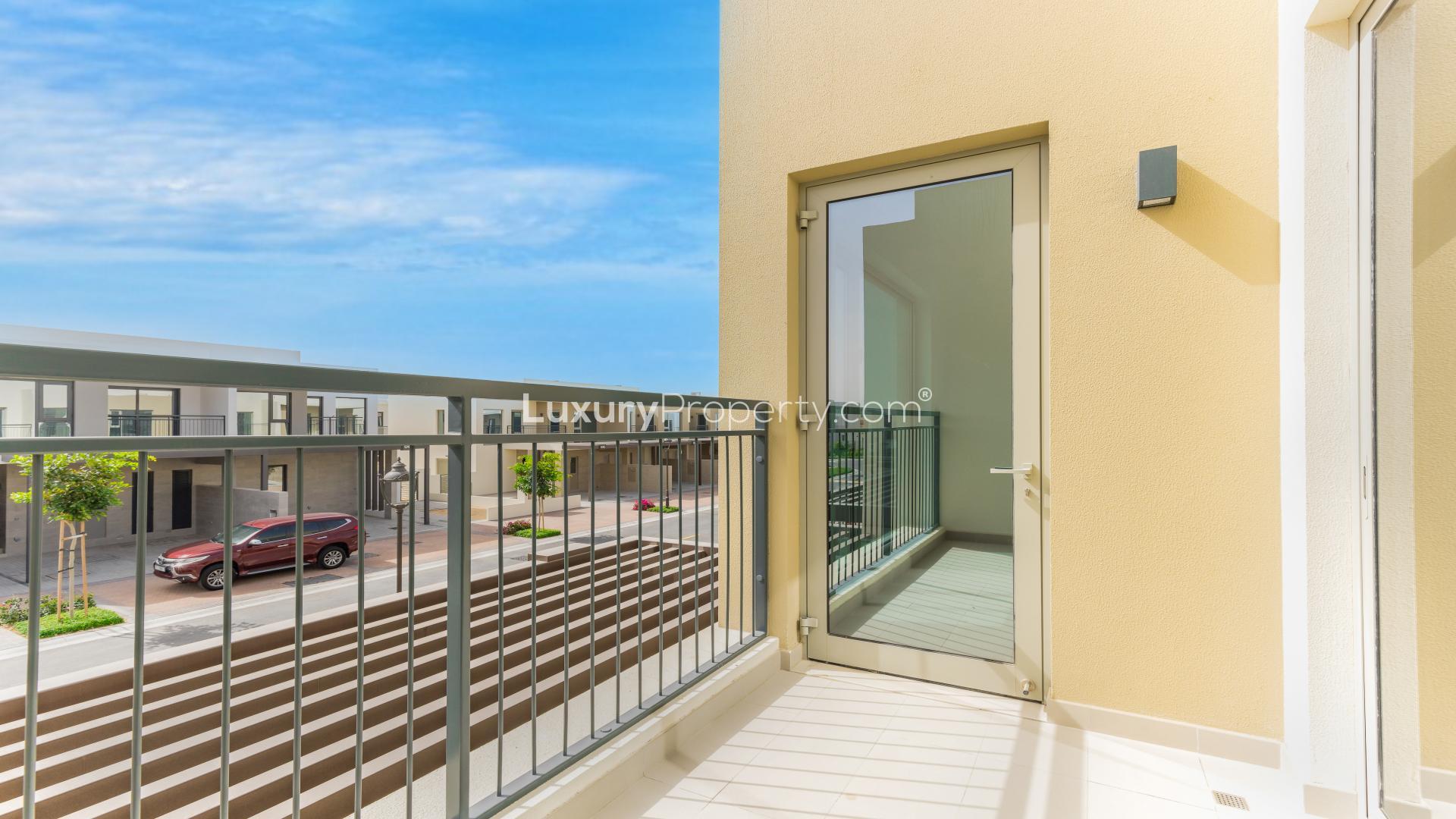 Bright kitchen and living area in Camelia townhouse, Arabian Ranches 2, with private terrace access