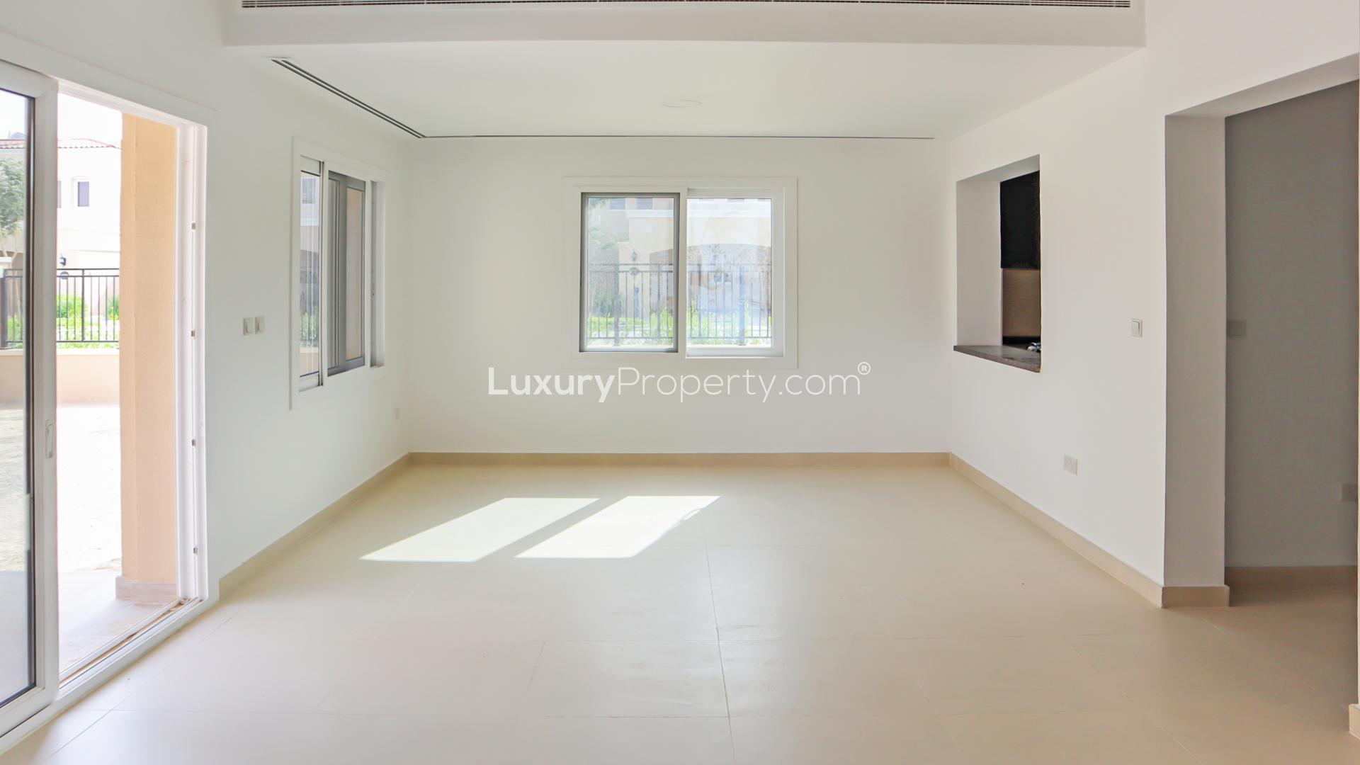 Semi-detached townhouse exterior in Serena, Dubai, with garage and garden, for sale