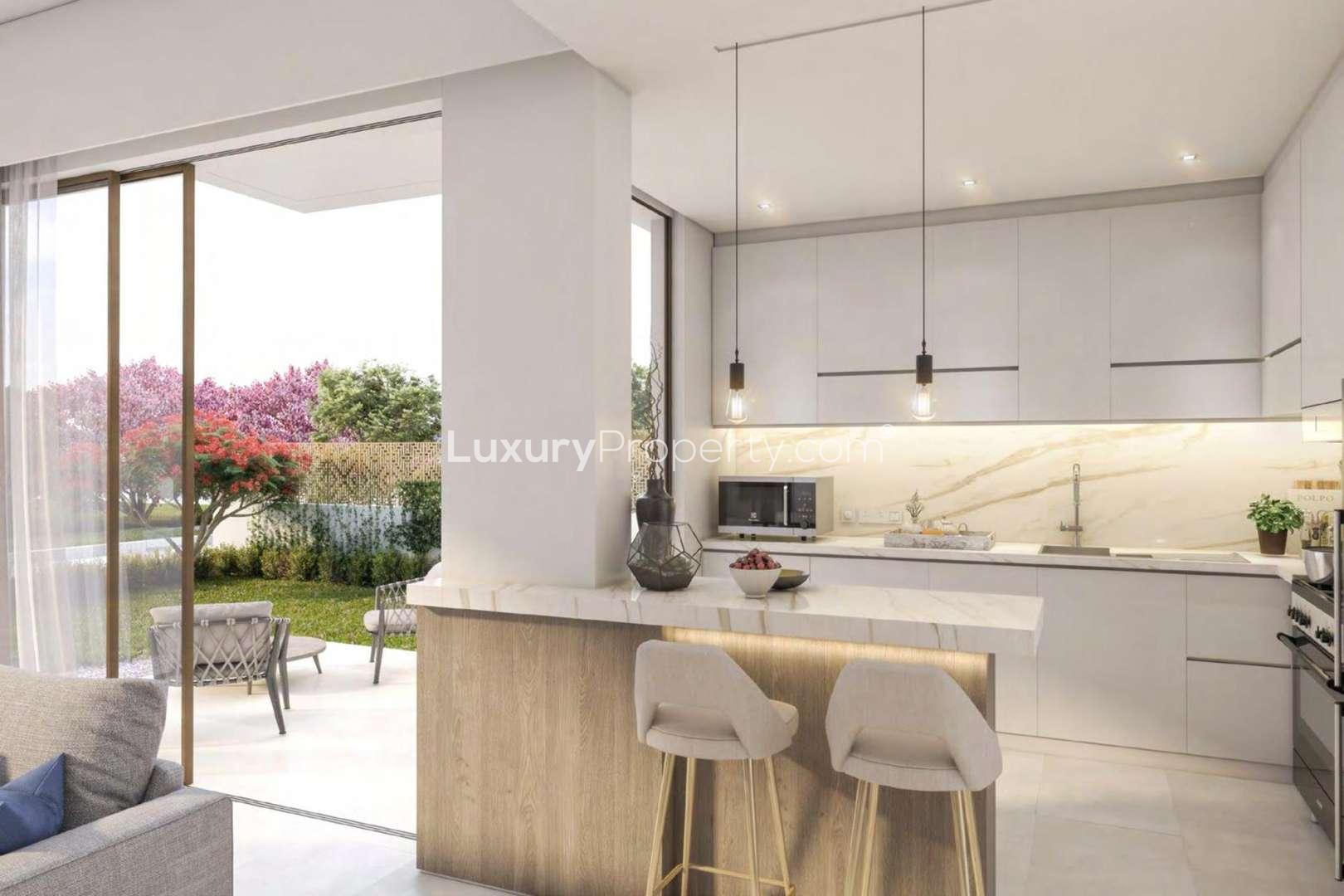 Modern 3-bedroom townhouse exterior in Cherrywoods, Dubailand, with lush garden view