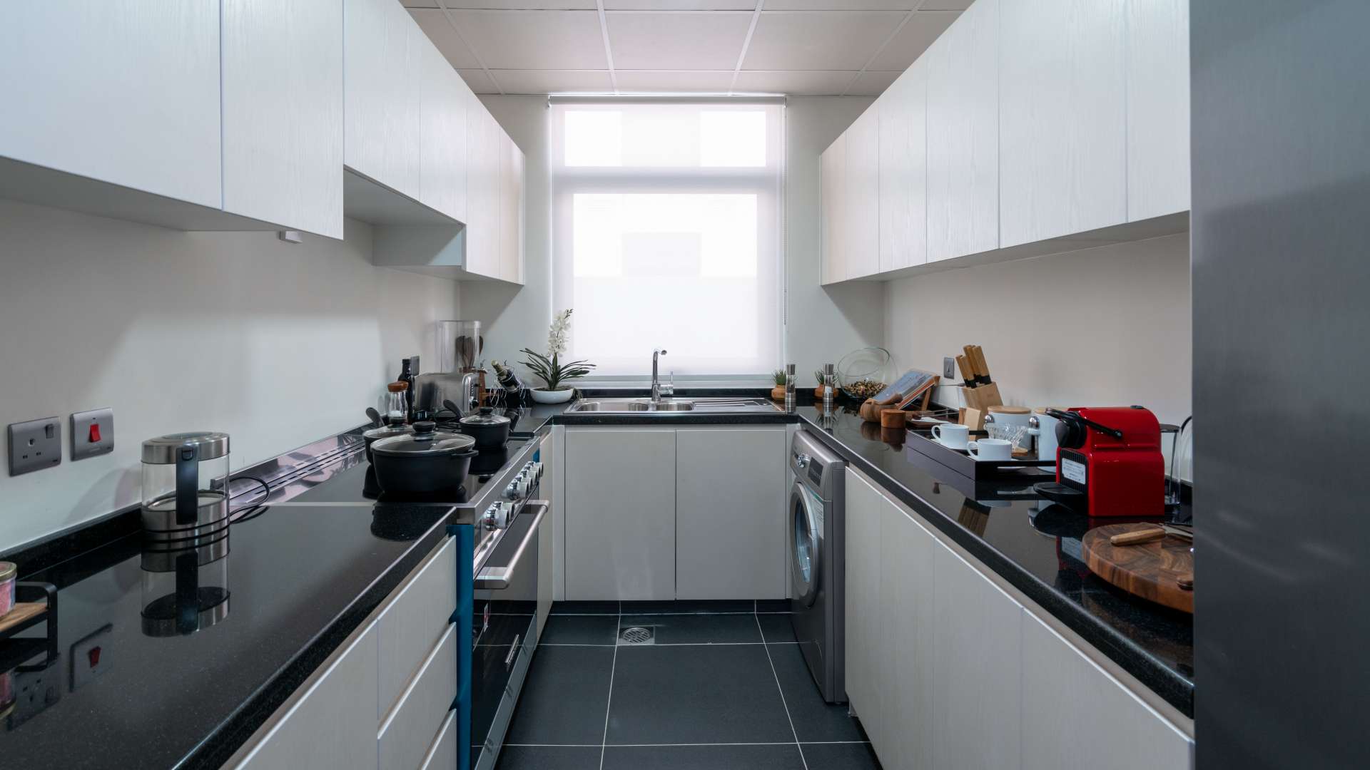 Elegant dining and living area in Dubailand townhouse, featuring modern decor and natural light