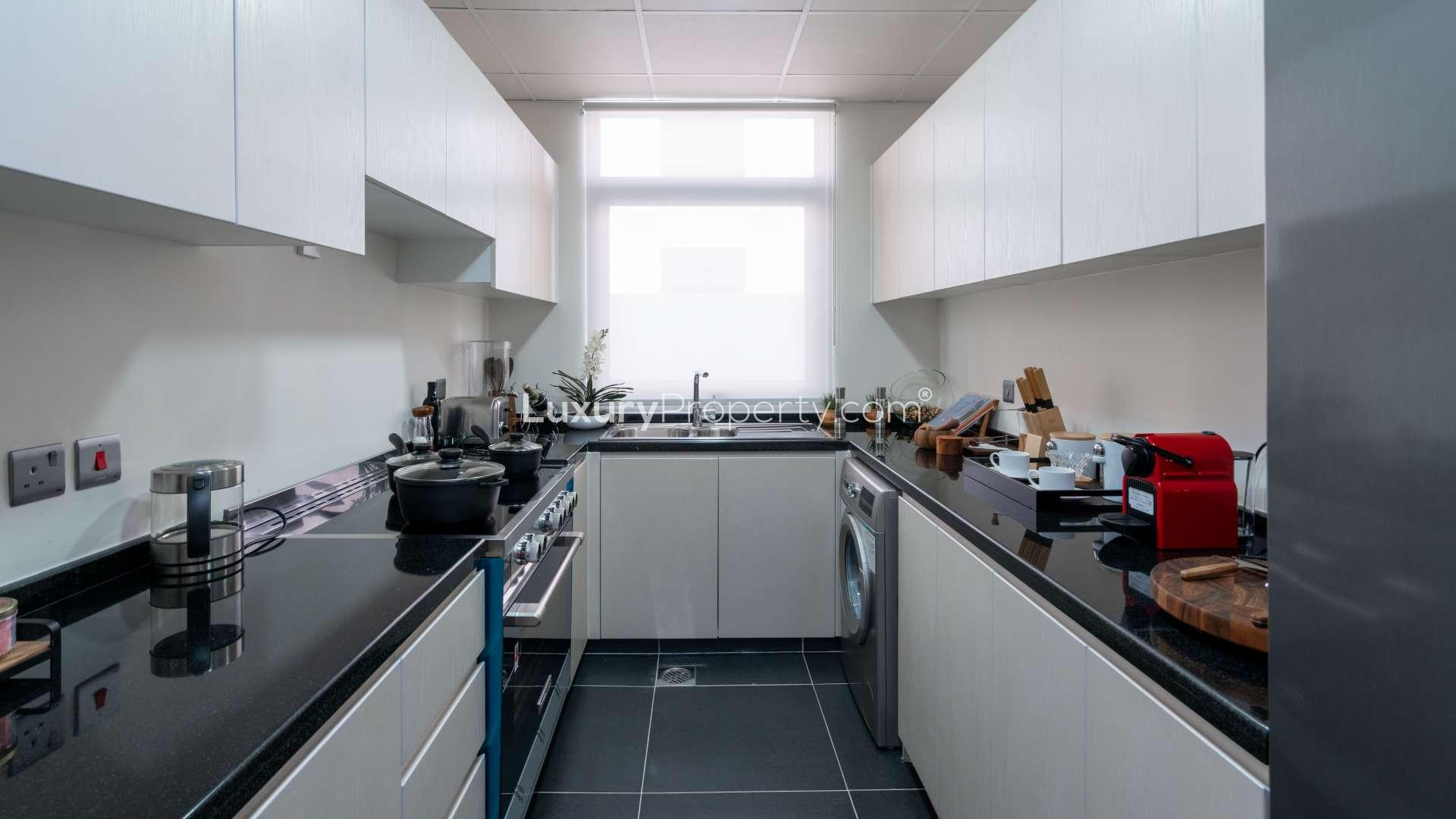 Stylish dining and living area in three-bedroom townhouse, Damac Hills 2, Claret community