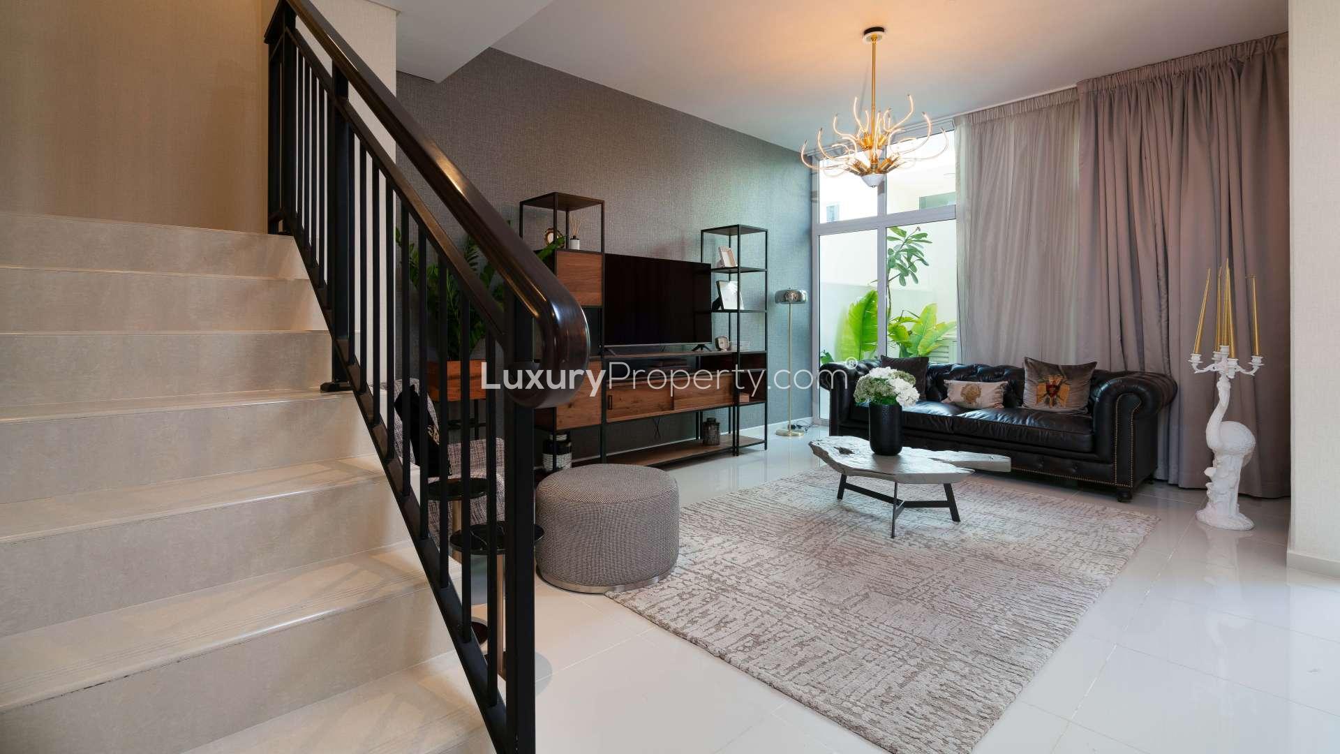 Modern kitchen in 3-bedroom townhouse, Damac Hills 2, Dubai, with sleek countertops and appliances