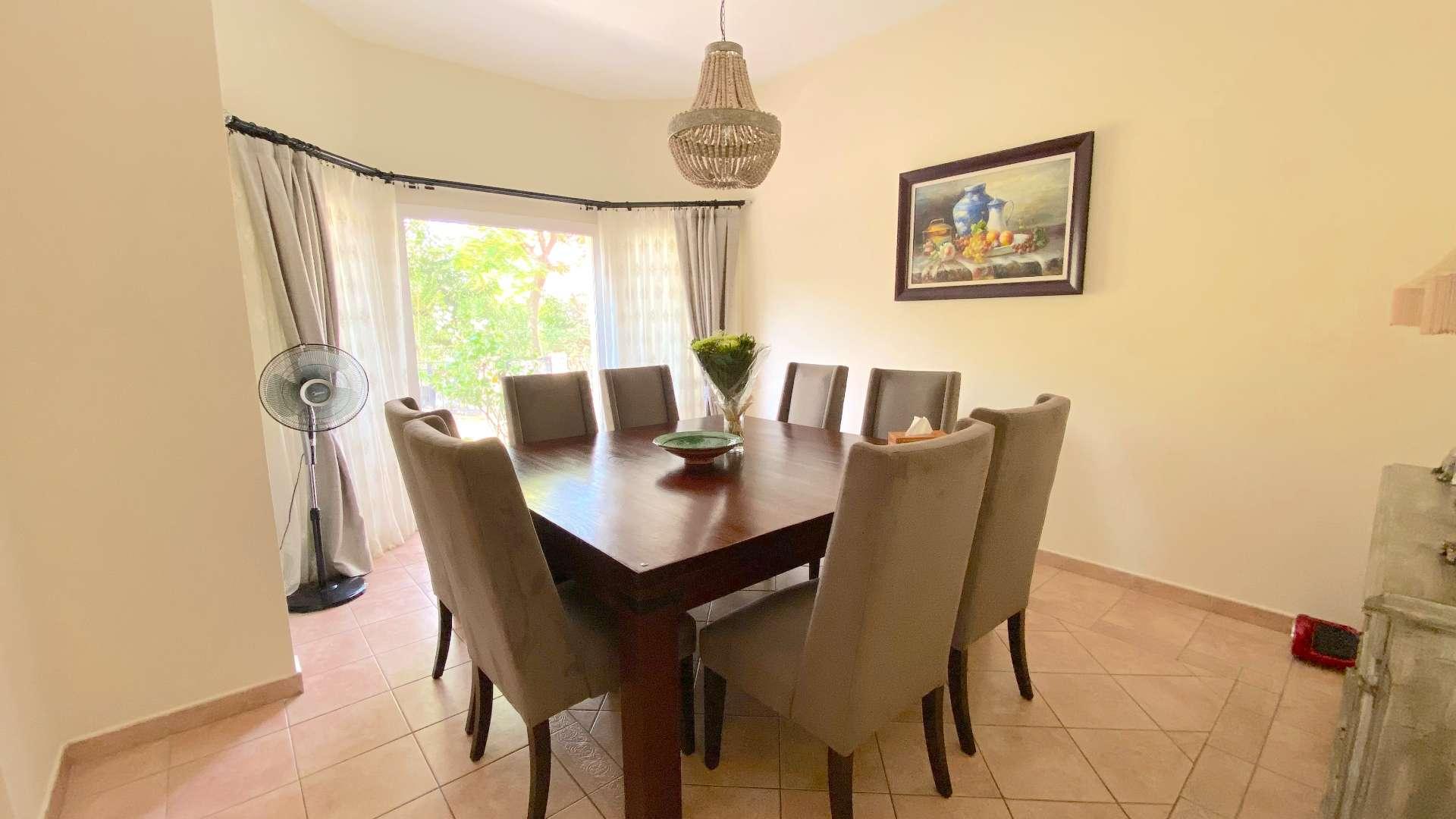 Upgraded 3-bedroom townhouse exterior with garden in Green Community East for sale