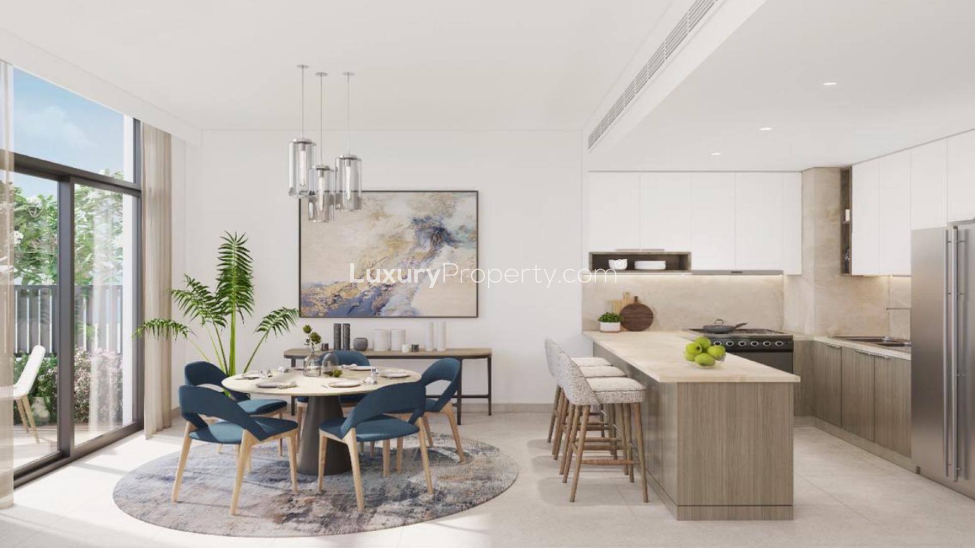 Elegant living room in Mudon Al Ranim 7 townhouse, featuring large windows and modern decor