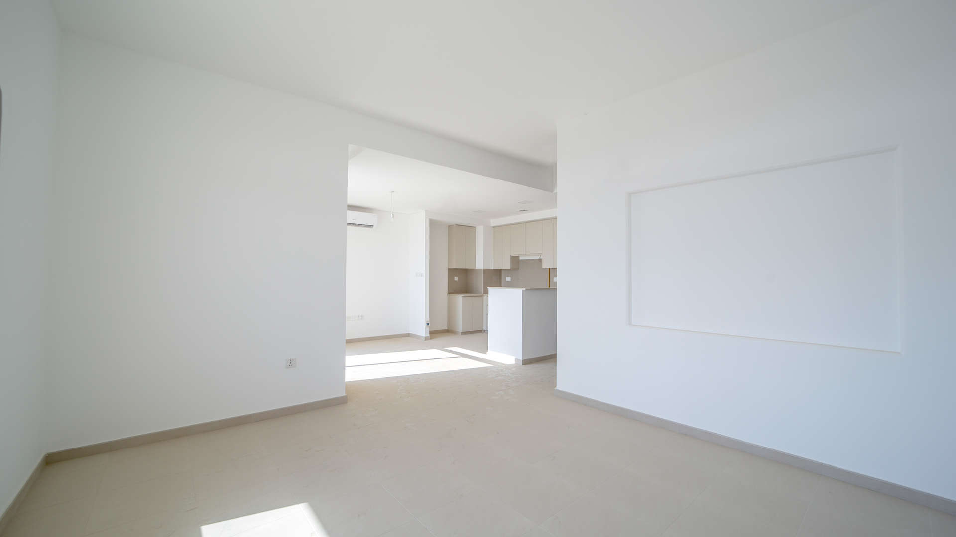 Modern kitchen and living area in Hayat Townhouse, Town Square, Dubai