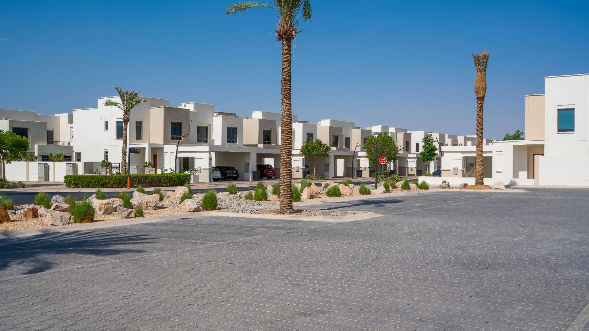 Modern living room in Hayat Town Square townhouse with large TV and stylish seating area