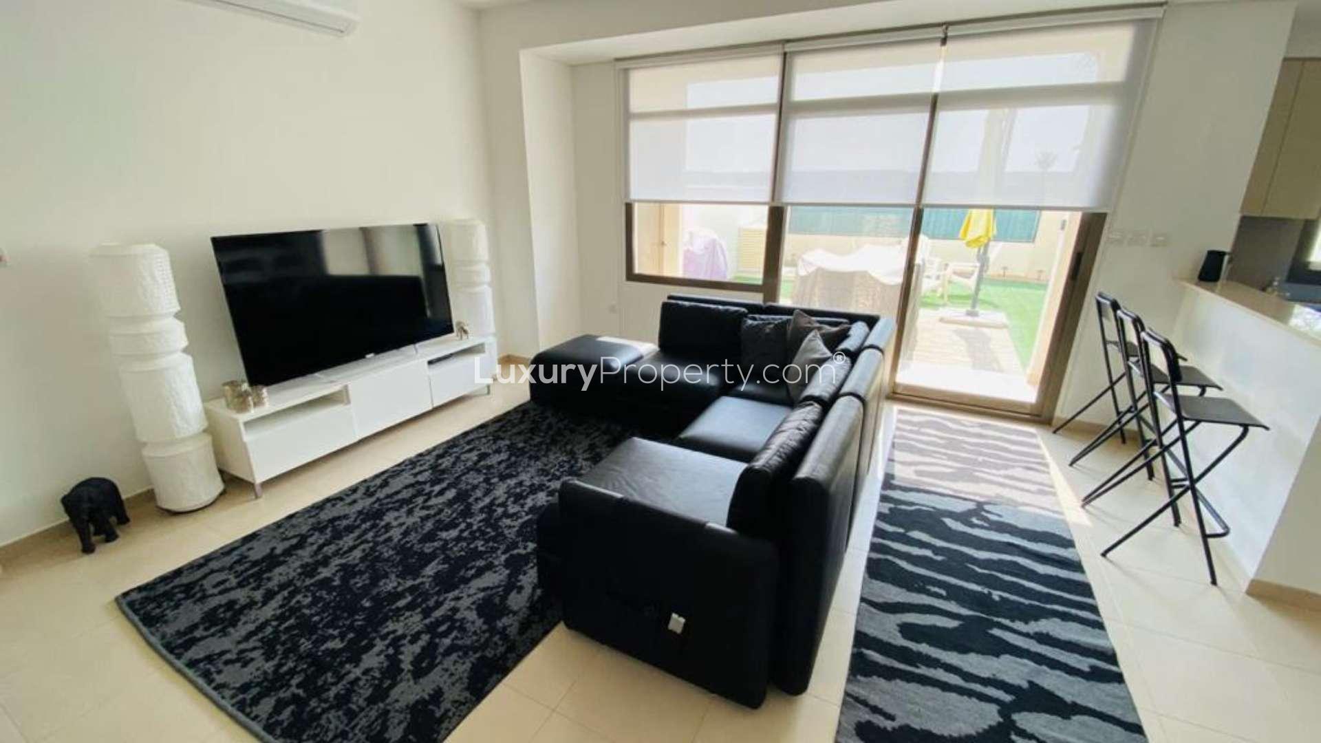 Beautiful 3-bedroom townhouse exterior in Hayat, Town Square, with carport and modern design