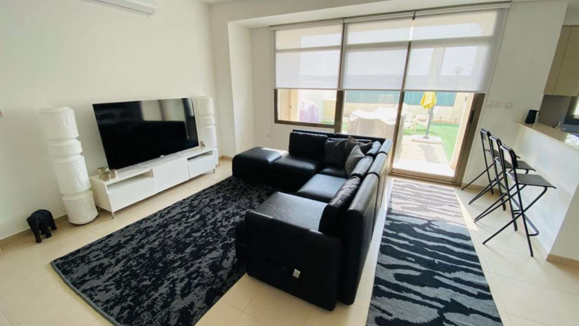 Beautiful 3-bedroom townhouse exterior in Hayat, Town Square, with carport and modern design