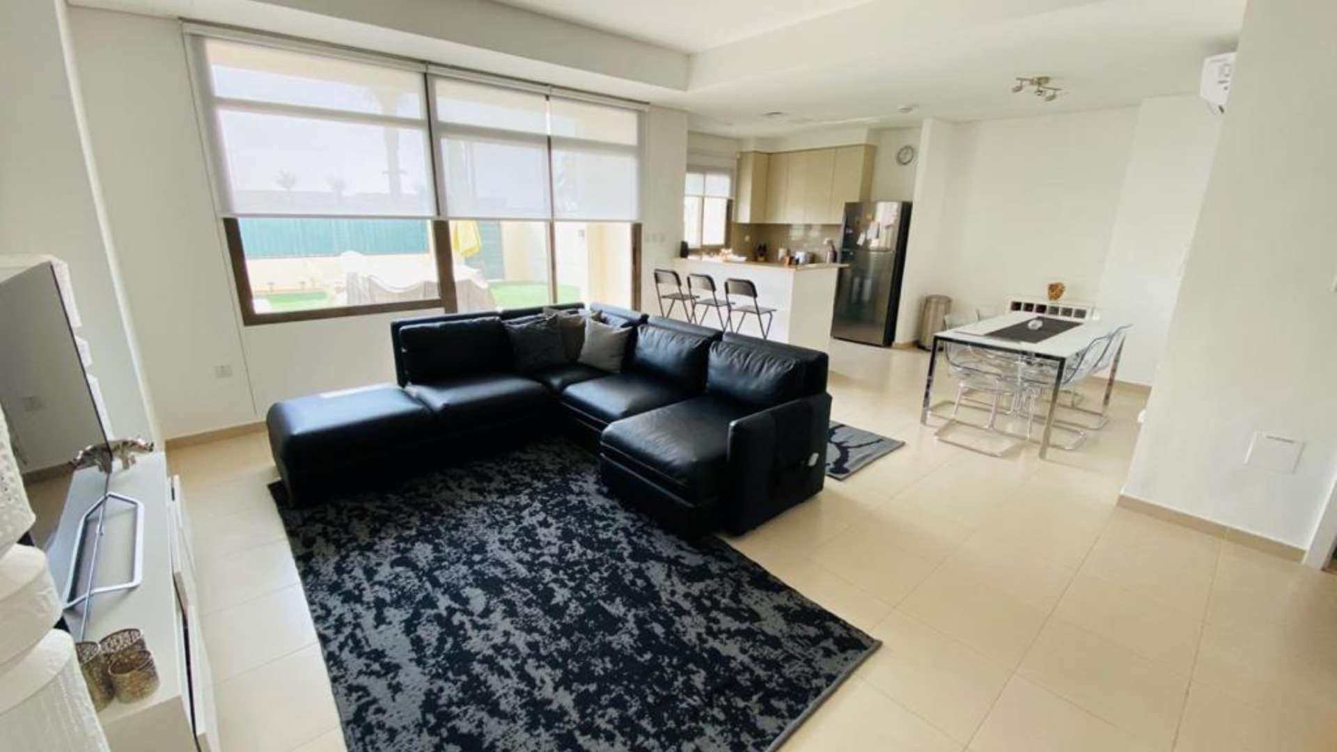 Single row townhouses in Hayat, Town Square, surrounded by landscaped greenery