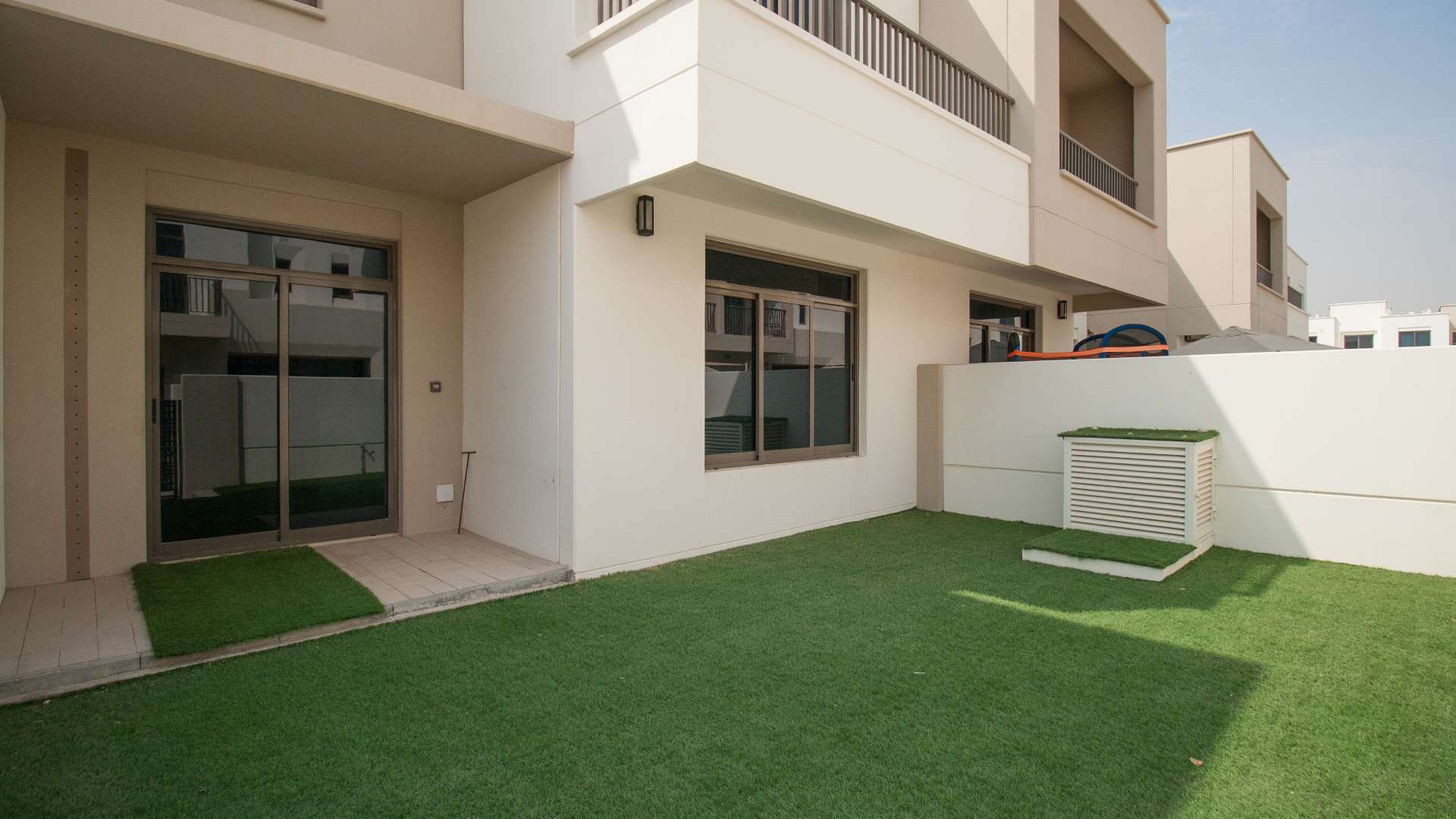 "Spacious bedroom with built-in wardrobe in Hayat Townhouse, Town Square, Dubai.",3-bedroom townhouse in Hayat, Town Square with landscaped garden for sale