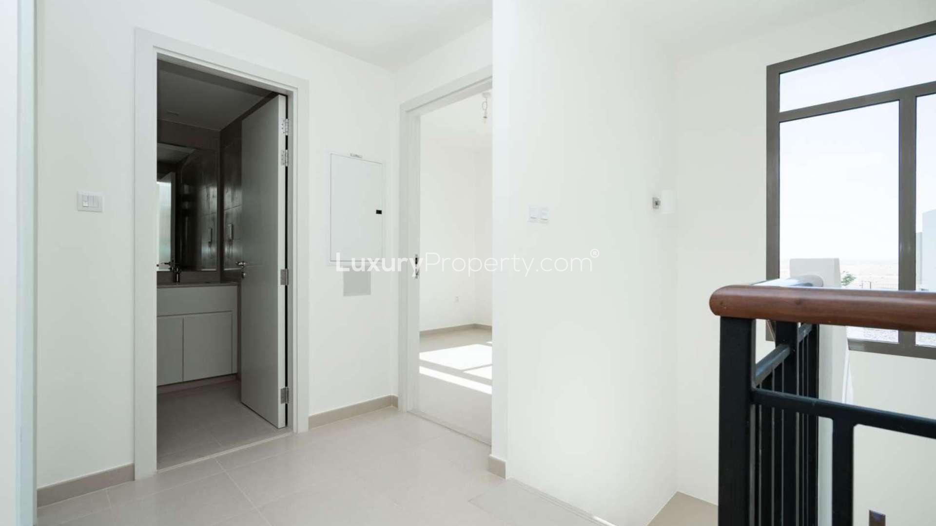 Staircase with window view in Hayat Townhouses, Town Square; bright and modern design