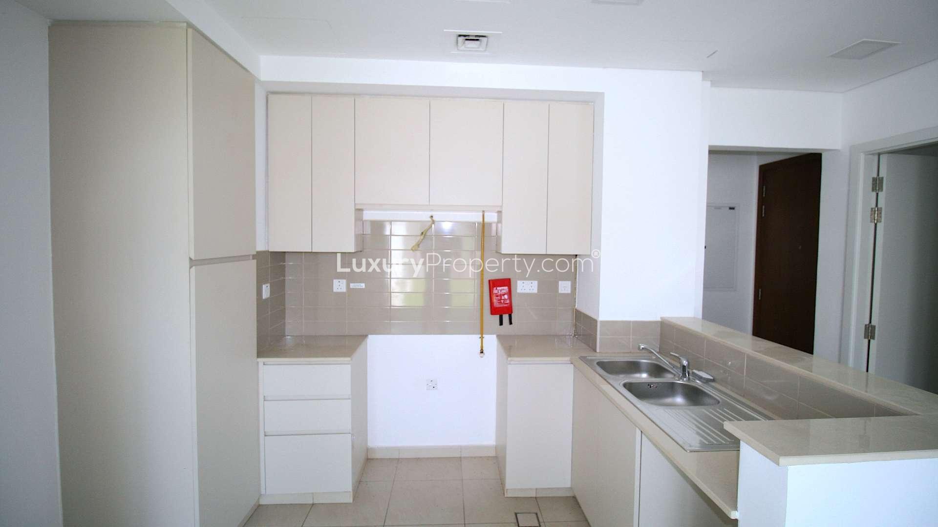 Stunning 3-bed townhouse exterior, lush garden, Hayat Townhouses, Town Square Dubai, for sale