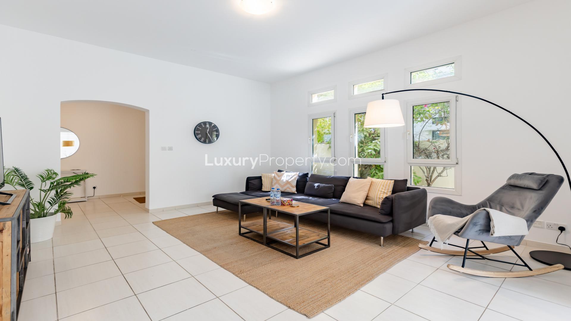 Modern living room in Zulal villa, The Lakes, with stylish decor and open dining area