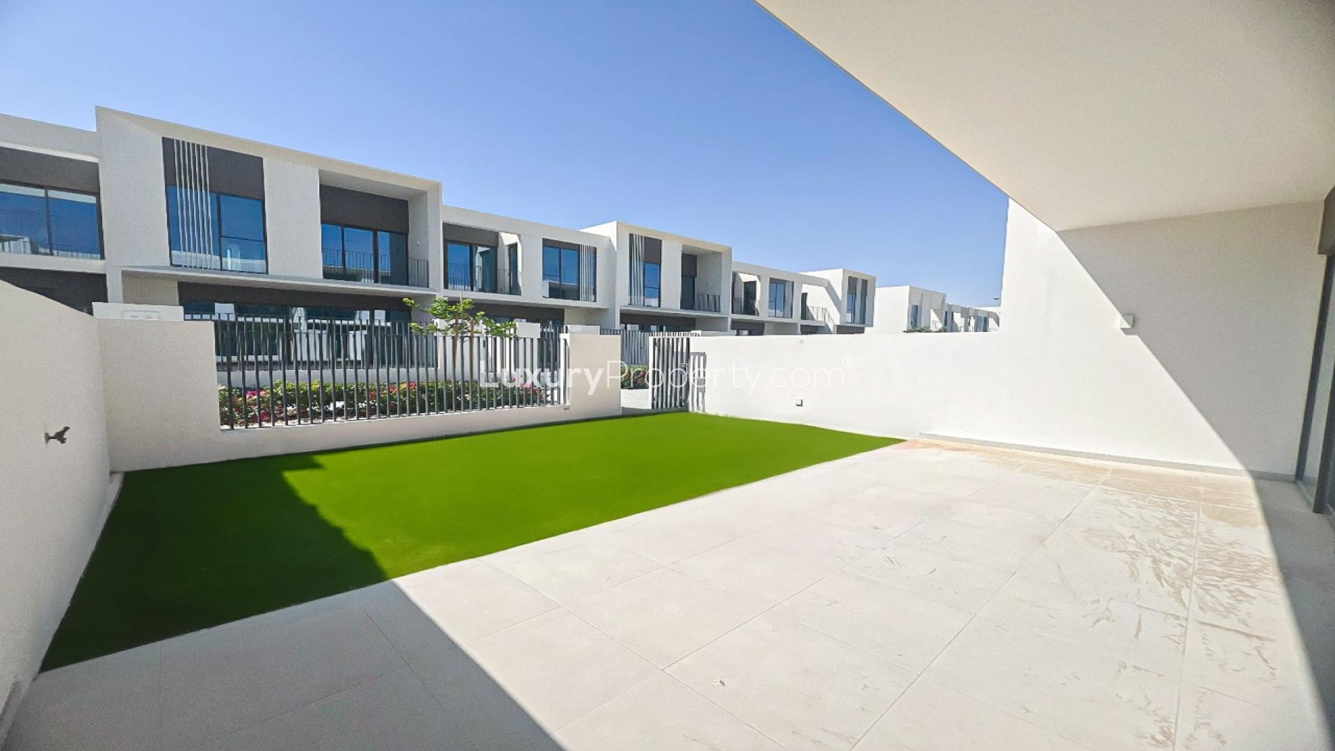 Spacious living area with large windows in 3-bed townhouse at The Valley, Talia