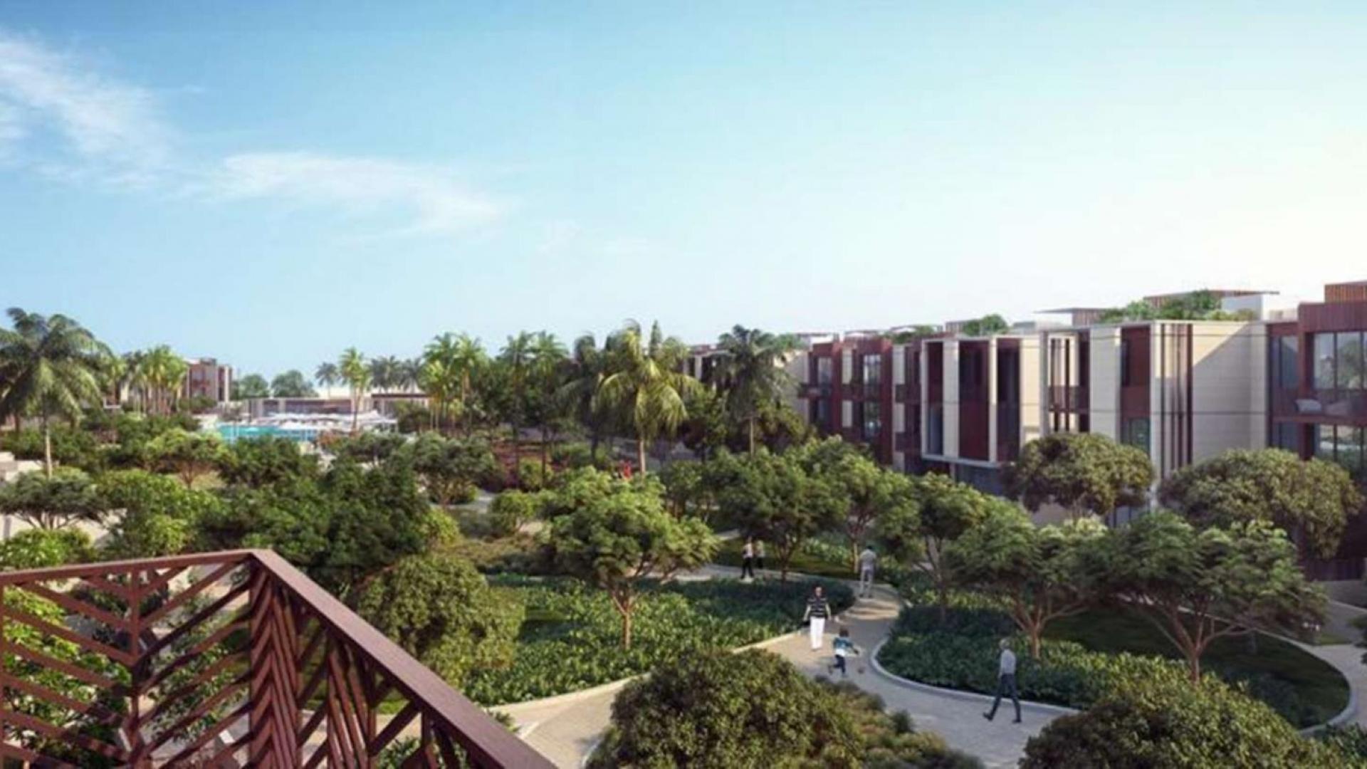 Stunning townhouse view with lush greenery in Jumeirah Bay Island community