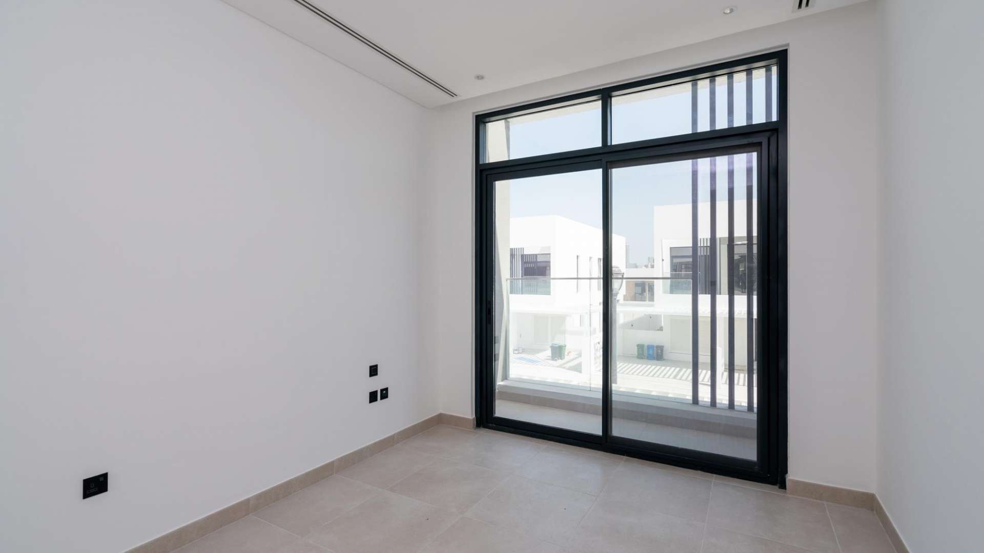 Contemporary walk-in closet with built-in shelving in Jumeirah Luxury townhouse, Dubai