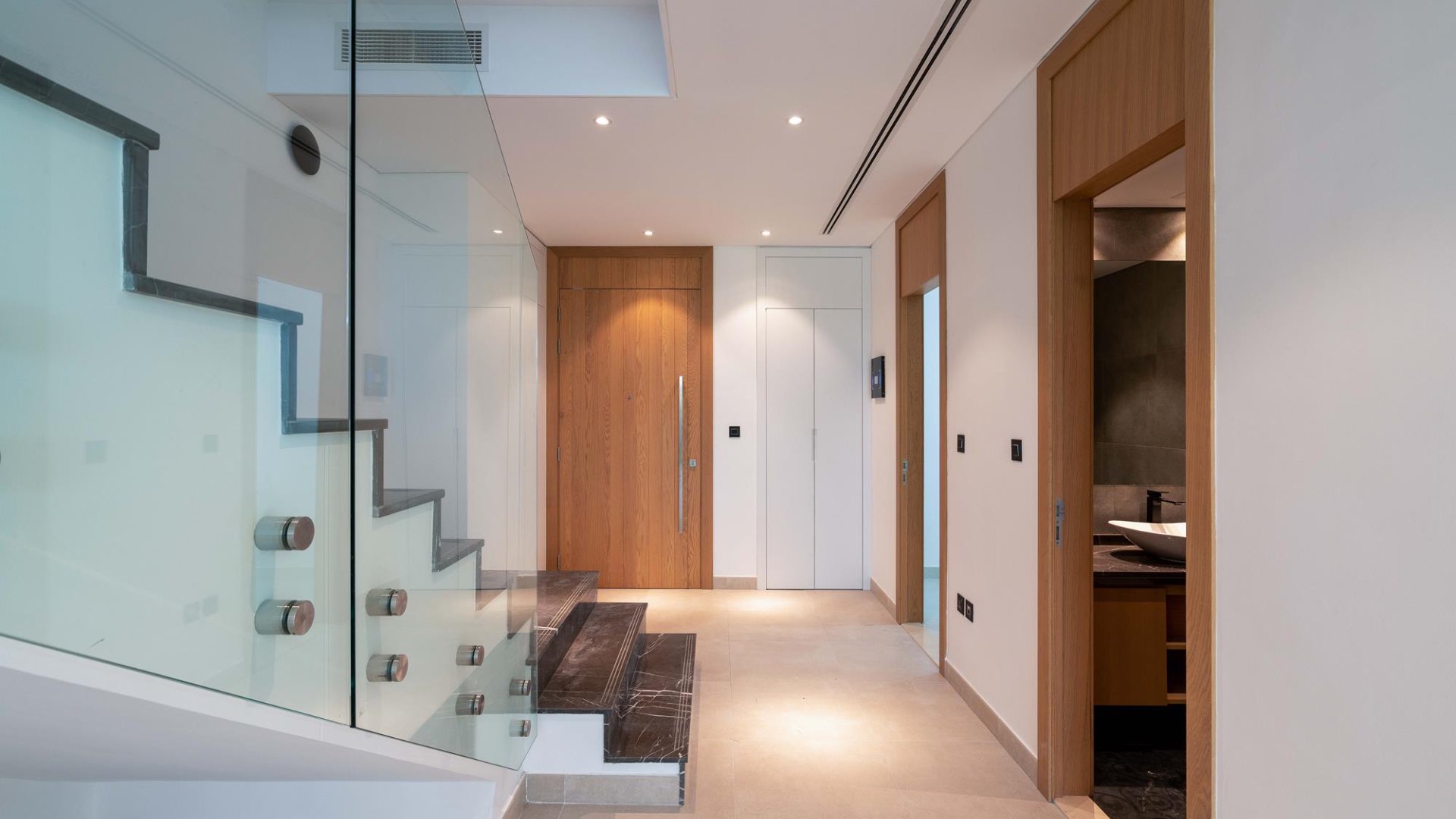 Modern kitchen and living area in Jumeirah Golf Estates townhouse for sale