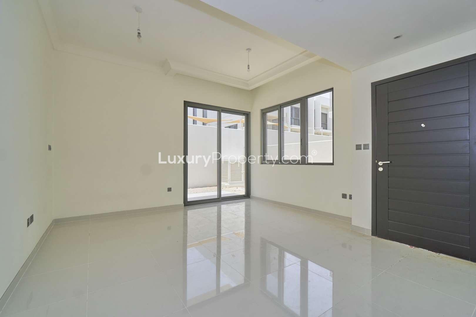 Three-bedroom townhouse exterior in Juniper, Damac Hills 2, Akoya community, for sale