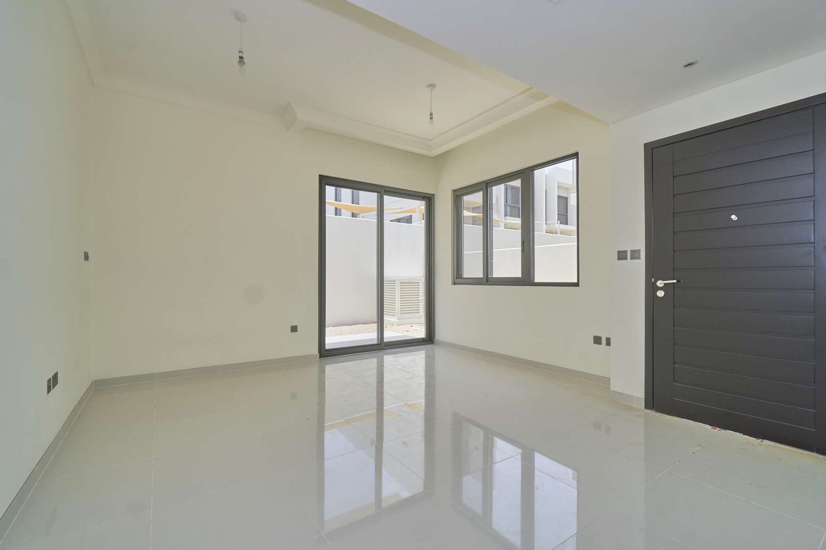 Three-bedroom townhouse exterior in Juniper, Damac Hills 2, Akoya community, for sale