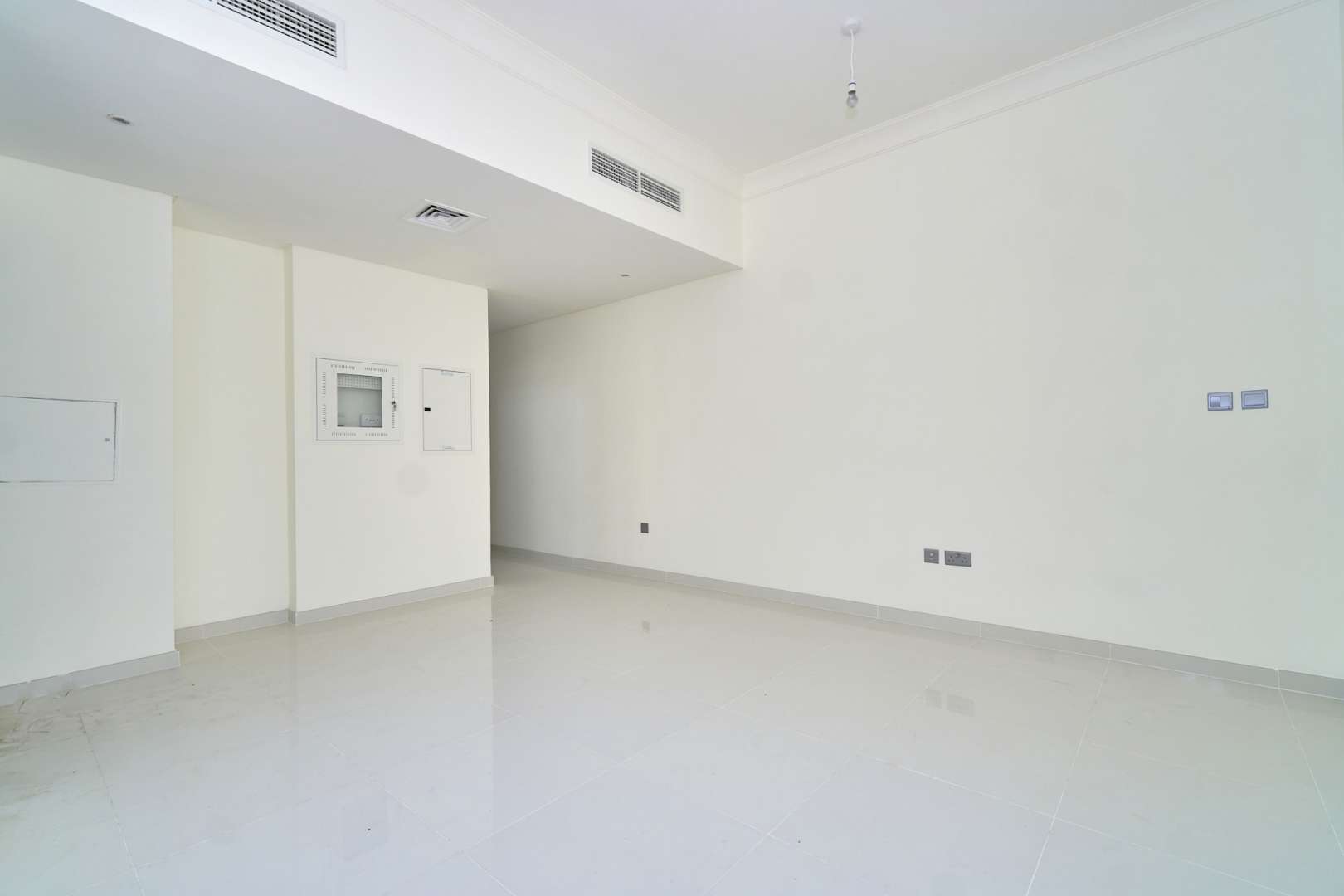 Bright living room with large window in Juniper townhouse, Damac Hills 2, Akoya community