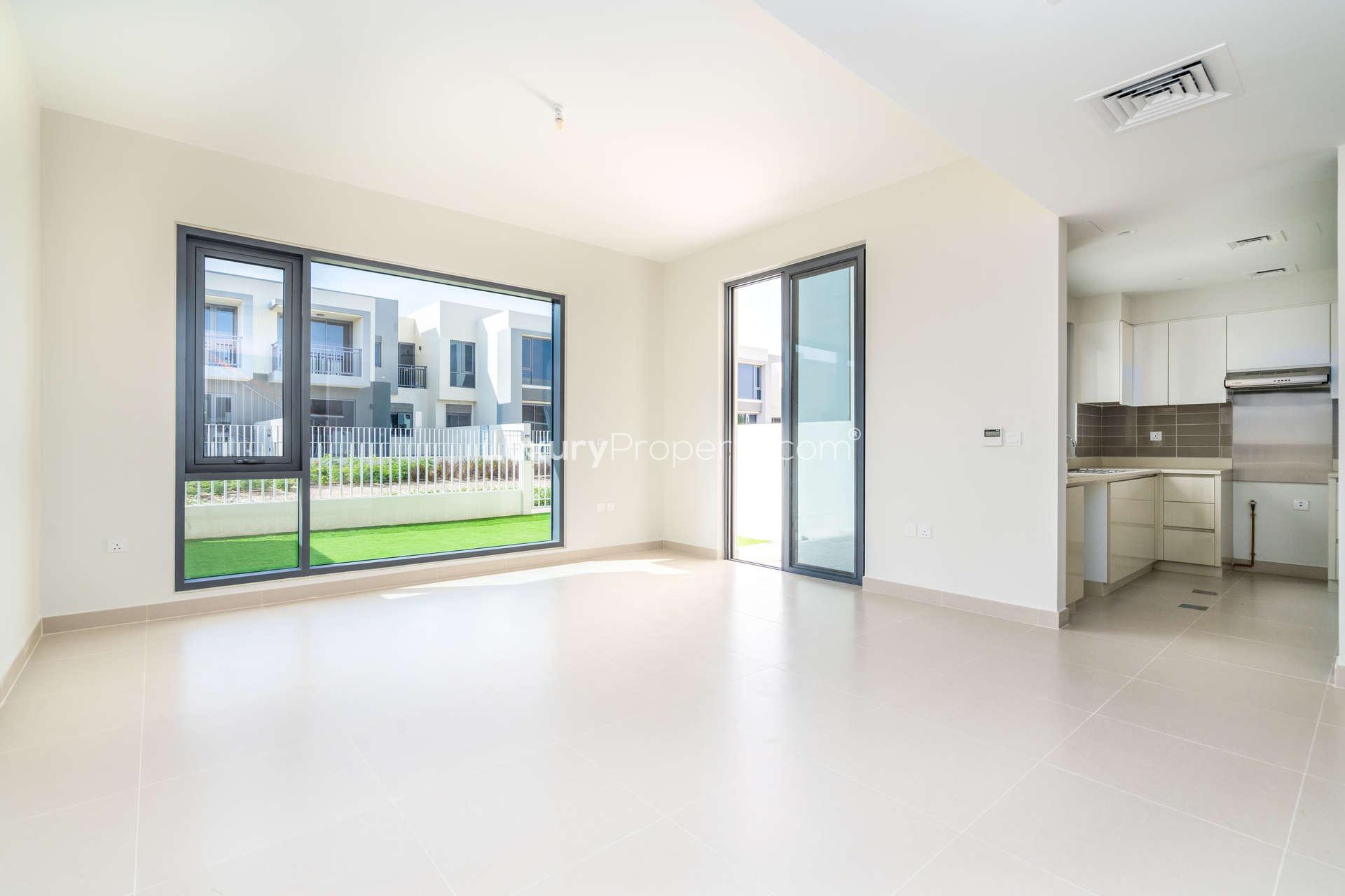 Elegant townhouse interior with sliding glass doors, Maple at Dubai Hills Estate