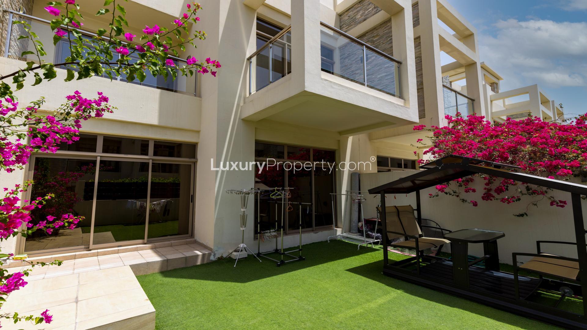Modern living room in Meydan Polo Townhouse with elegant decor and ample natural light