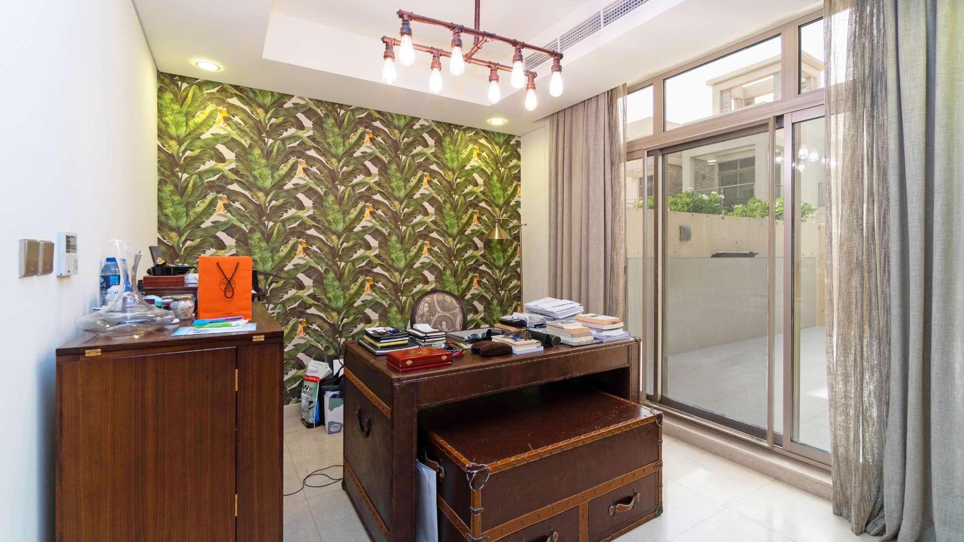 Living room in spacious Meydan Polo Townhouse with modern decor and ample natural light