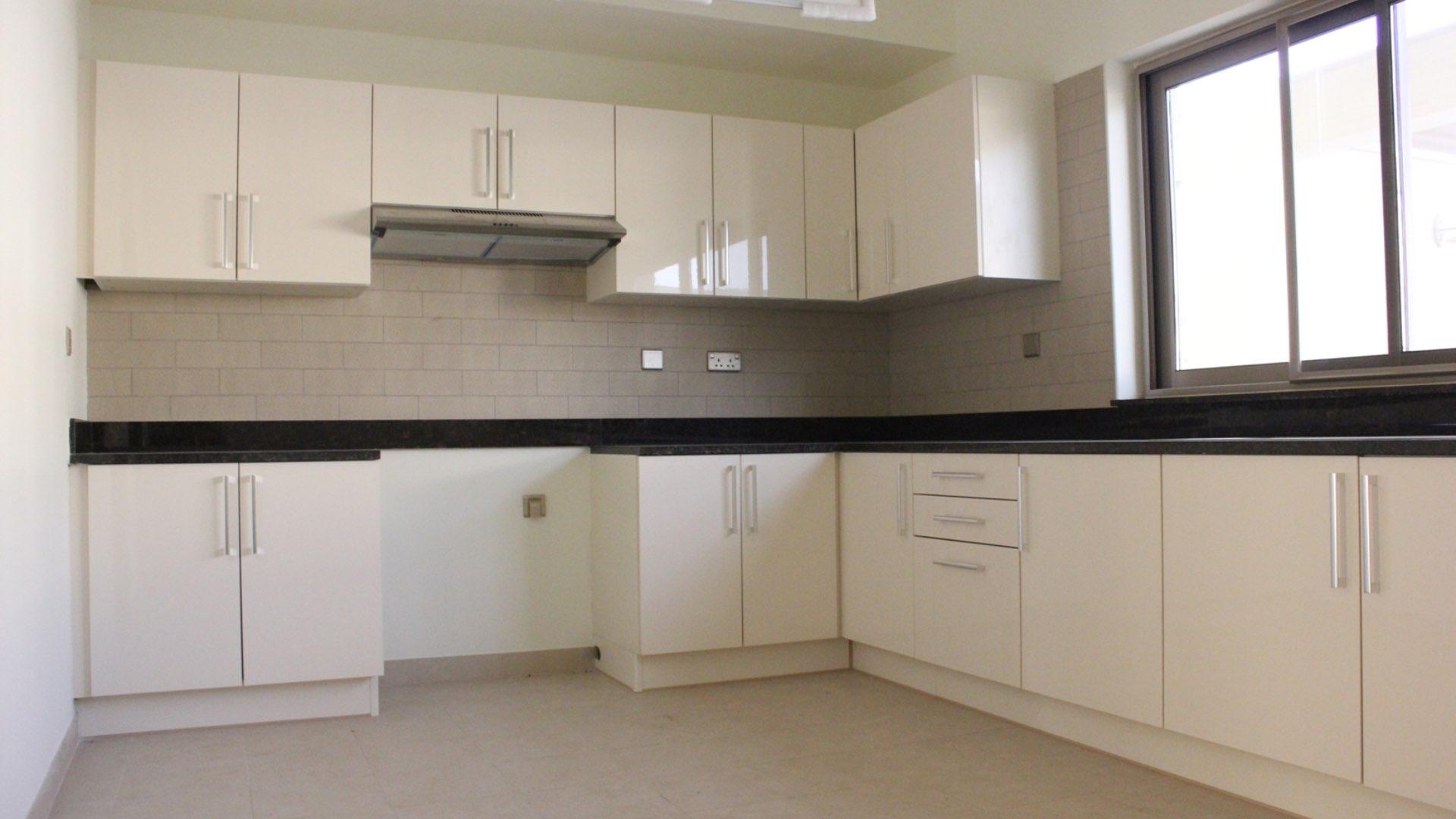 Townhouse balcony view in Meydan Gated Community, spacious residential area for sale