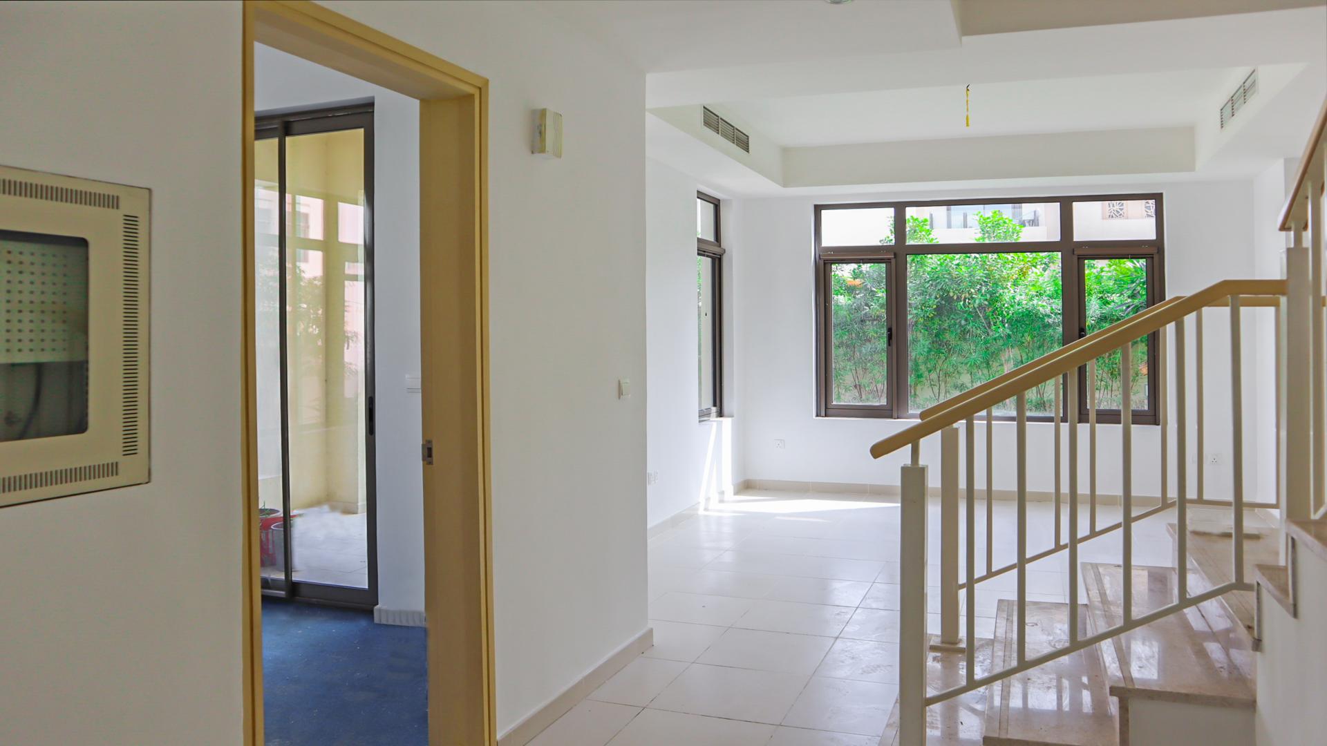 N/A,Bright interior of 3-bedroom villa in Mira Oasis, Reem Community with large windows and stairs