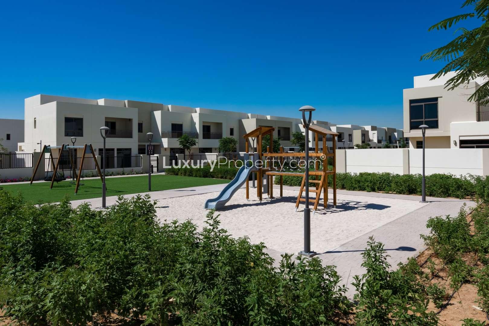 Pathway view of Naseem Townhouses, Town Square, landscaped greenery, modern architecture, for sale