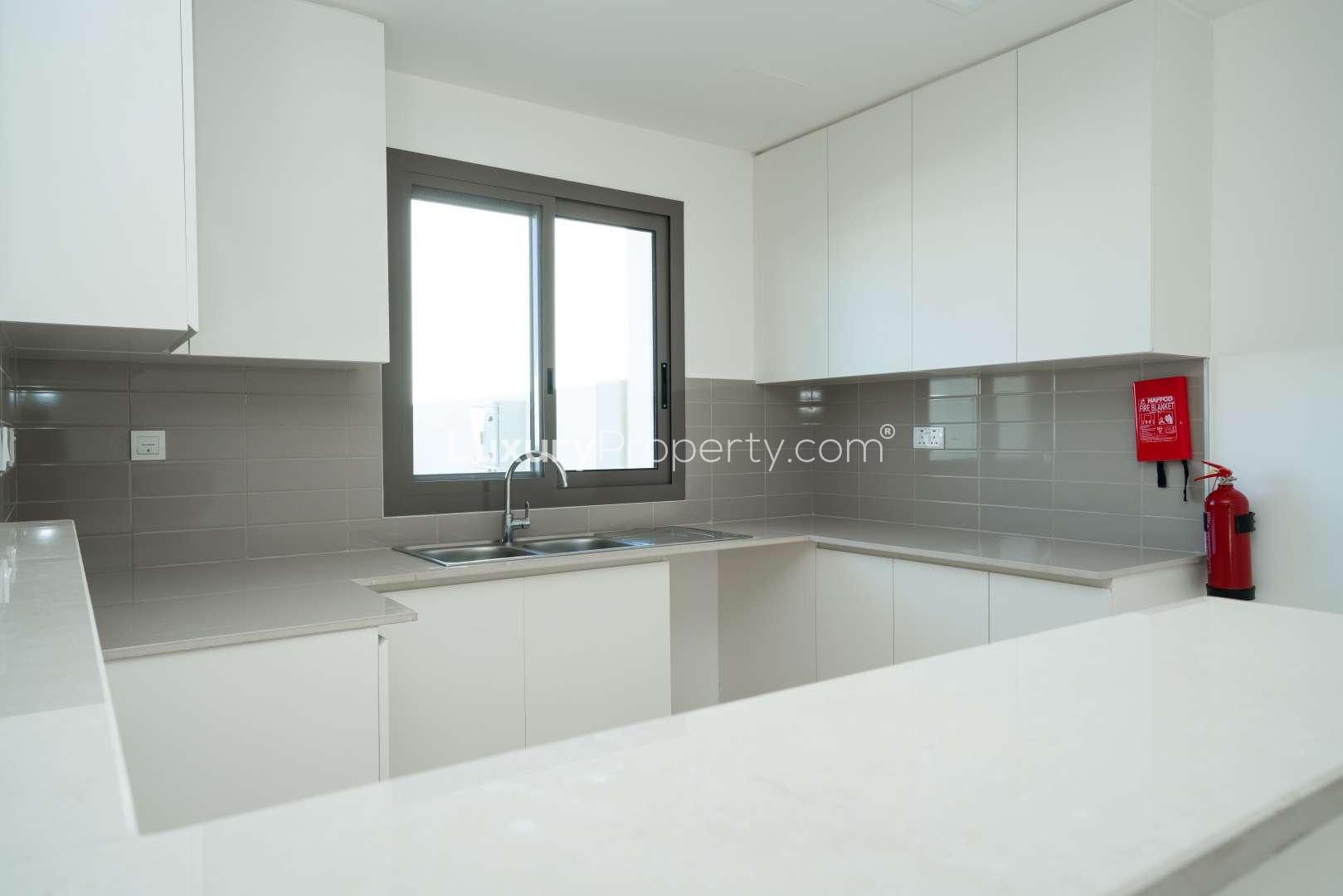 Playground in Naseem Town Square townhouse community, showcasing residential properties for sale