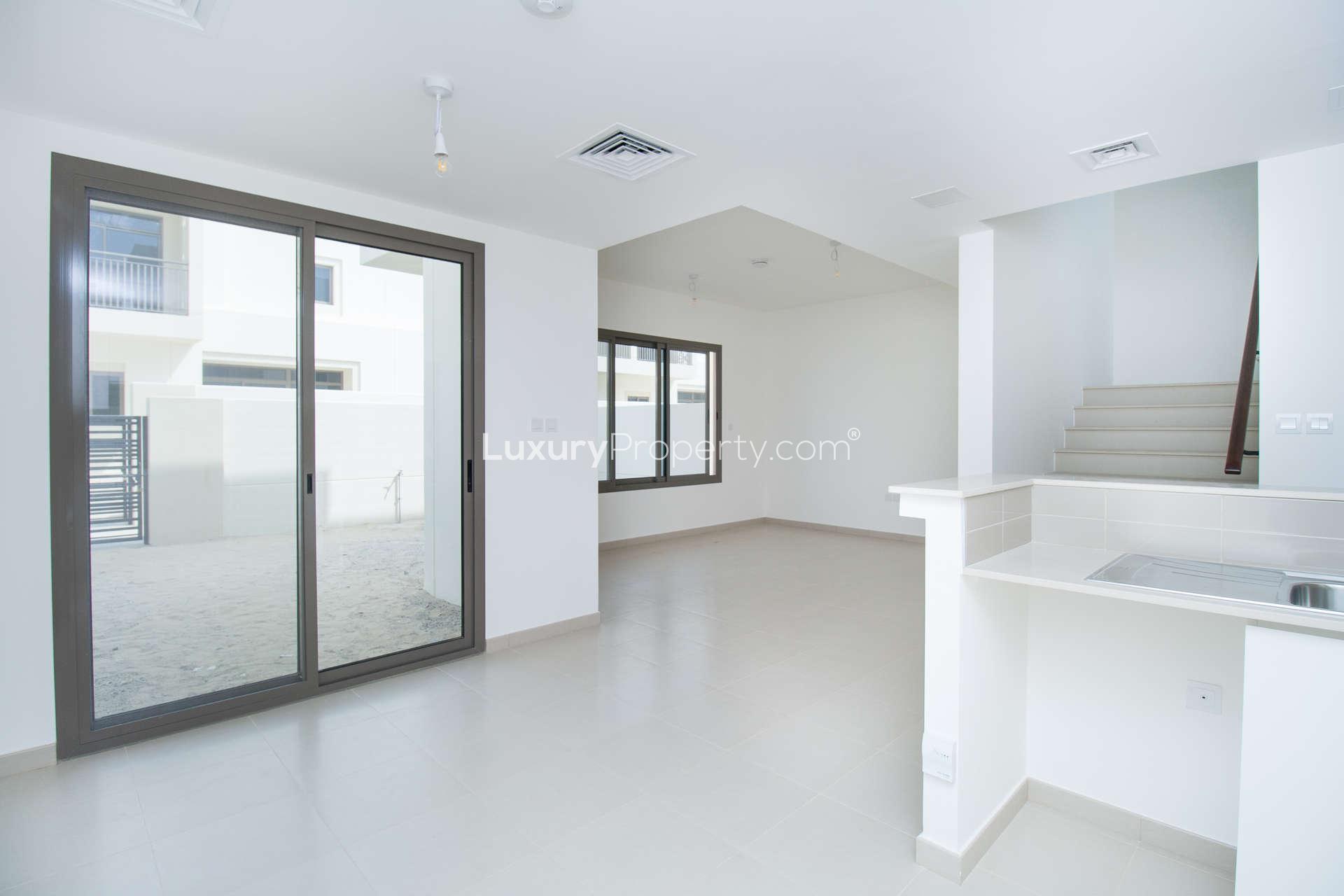 Modern kitchen and staircase in 3-bedroom townhouse, Noor, Town Square Dubai