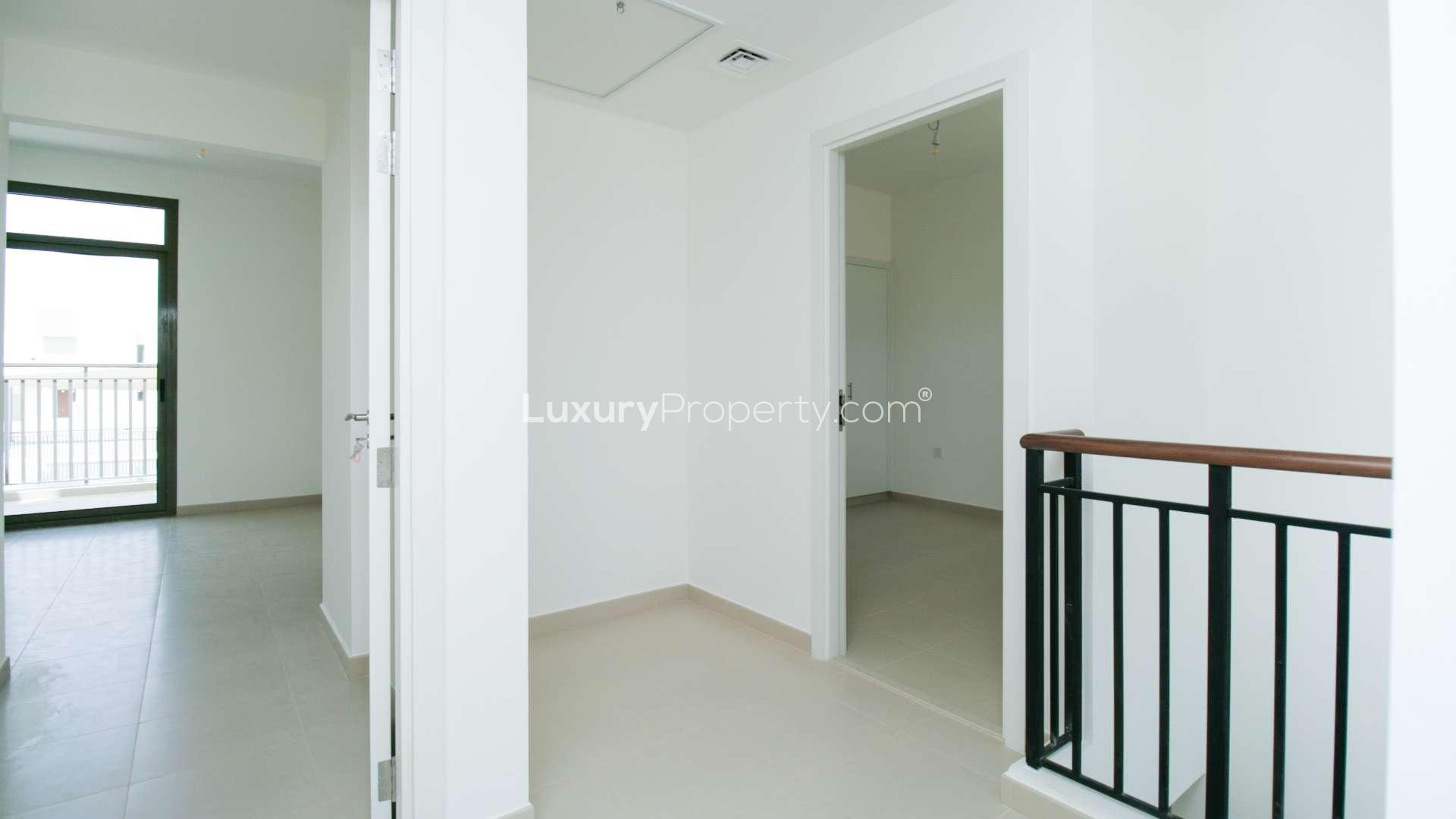 Modern kitchen interior in 3-bedroom townhouse, Noor Townhouses, Town Square, for sale