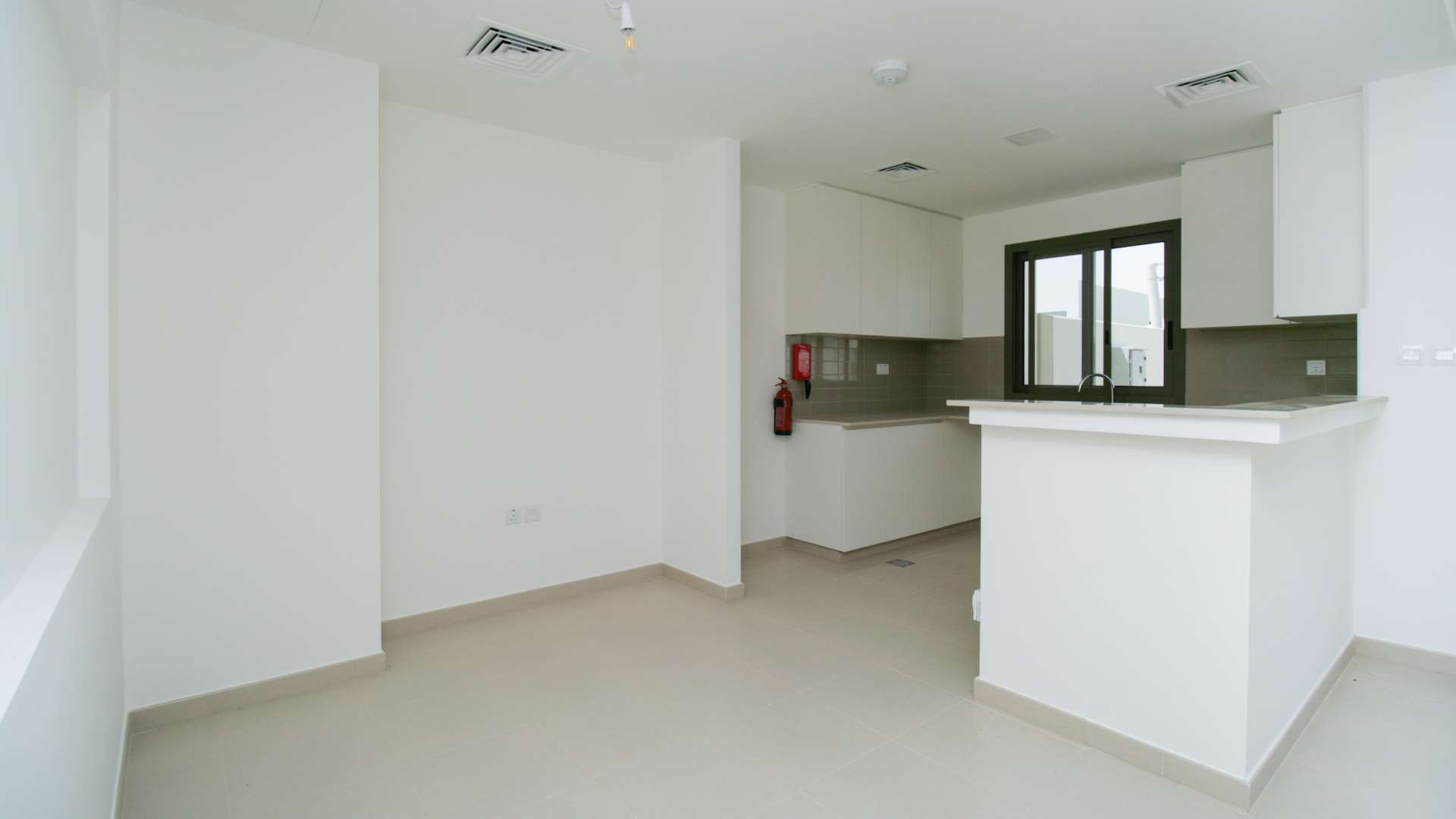 Modern kitchen in 3-bedroom townhouse, Noor Townhouses, Town Square, for sale
