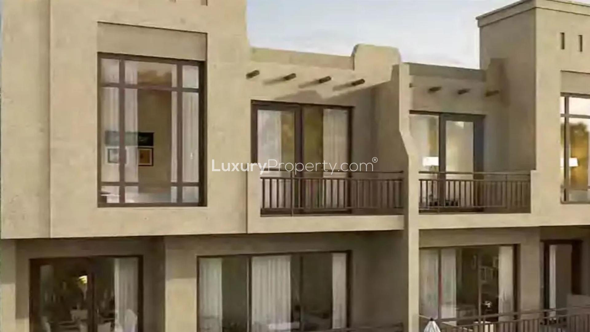 "Modern 3-bedroom townhouse exterior in Damac Hills 2, Victoria 2 community for sale.",Genuine resale townhouse exterior in Damac Hills 2, Victoria 2, with large windows and balconies