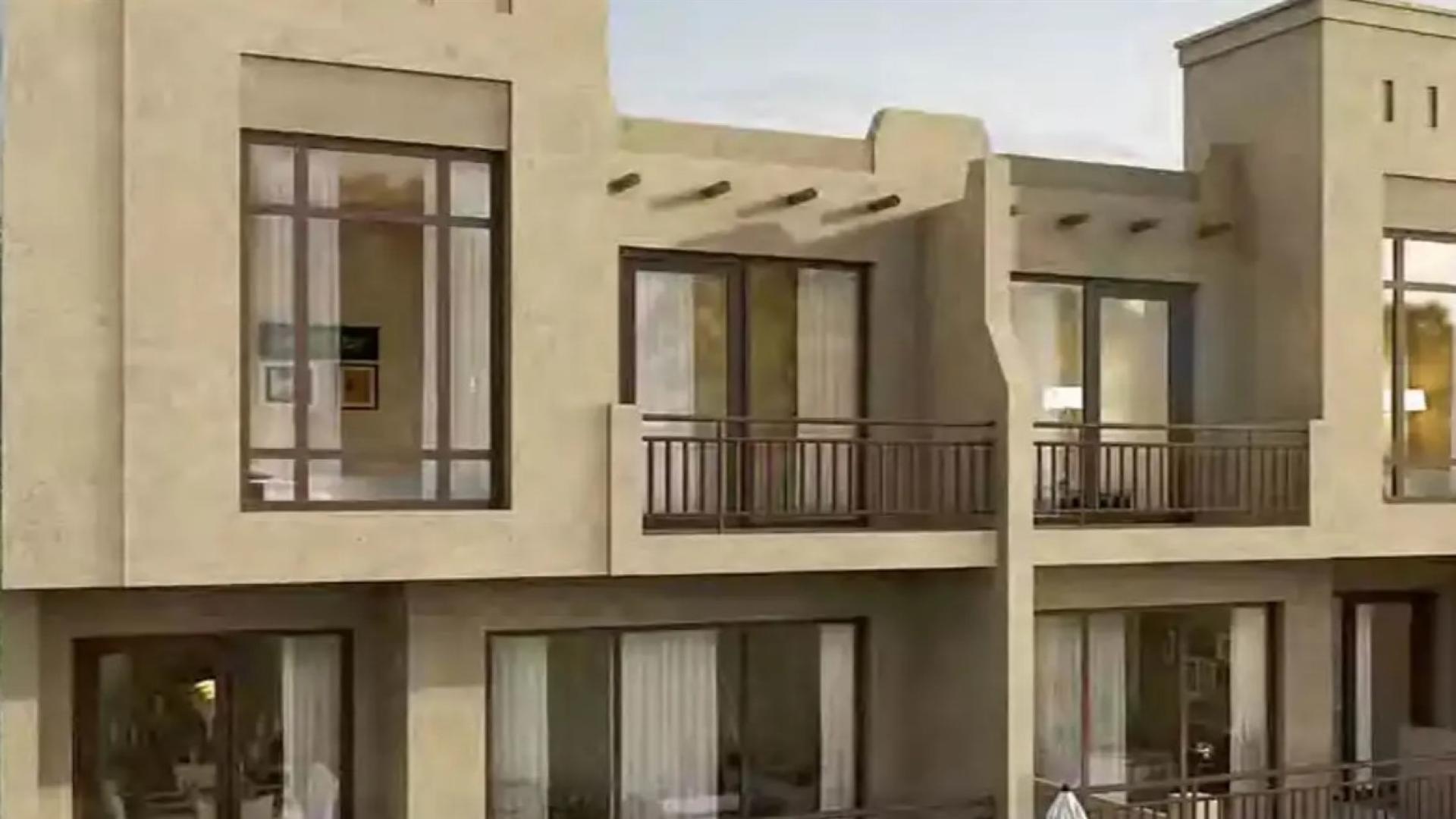 "Modern 3-bedroom townhouse exterior in Damac Hills 2, Victoria 2 community for sale.",Genuine resale townhouse exterior in Damac Hills 2, Victoria 2, with large windows and balconies