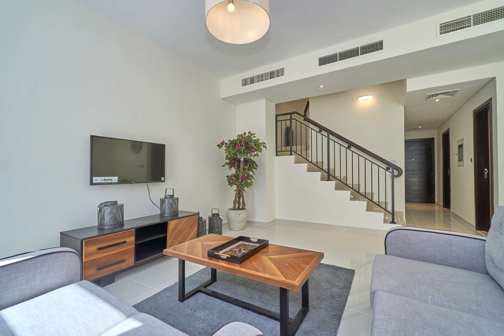 Modern living room in luxury 3-bedroom townhouse, Pacifica, Damac Hills 2, for sale