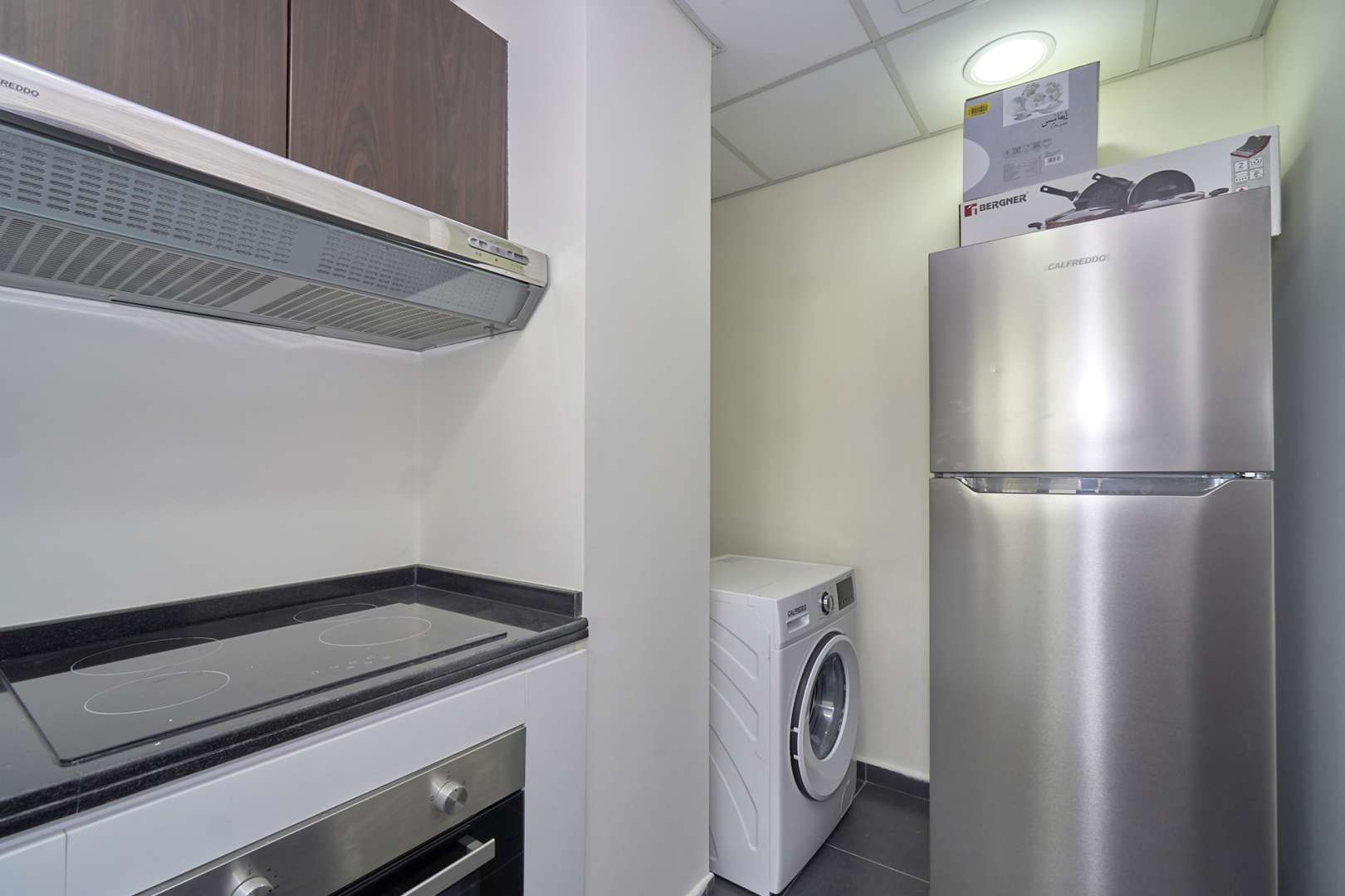 Modern kitchen with appliances in fully furnished townhouse, Pacifica, Akoya by DAMAC Hills 2