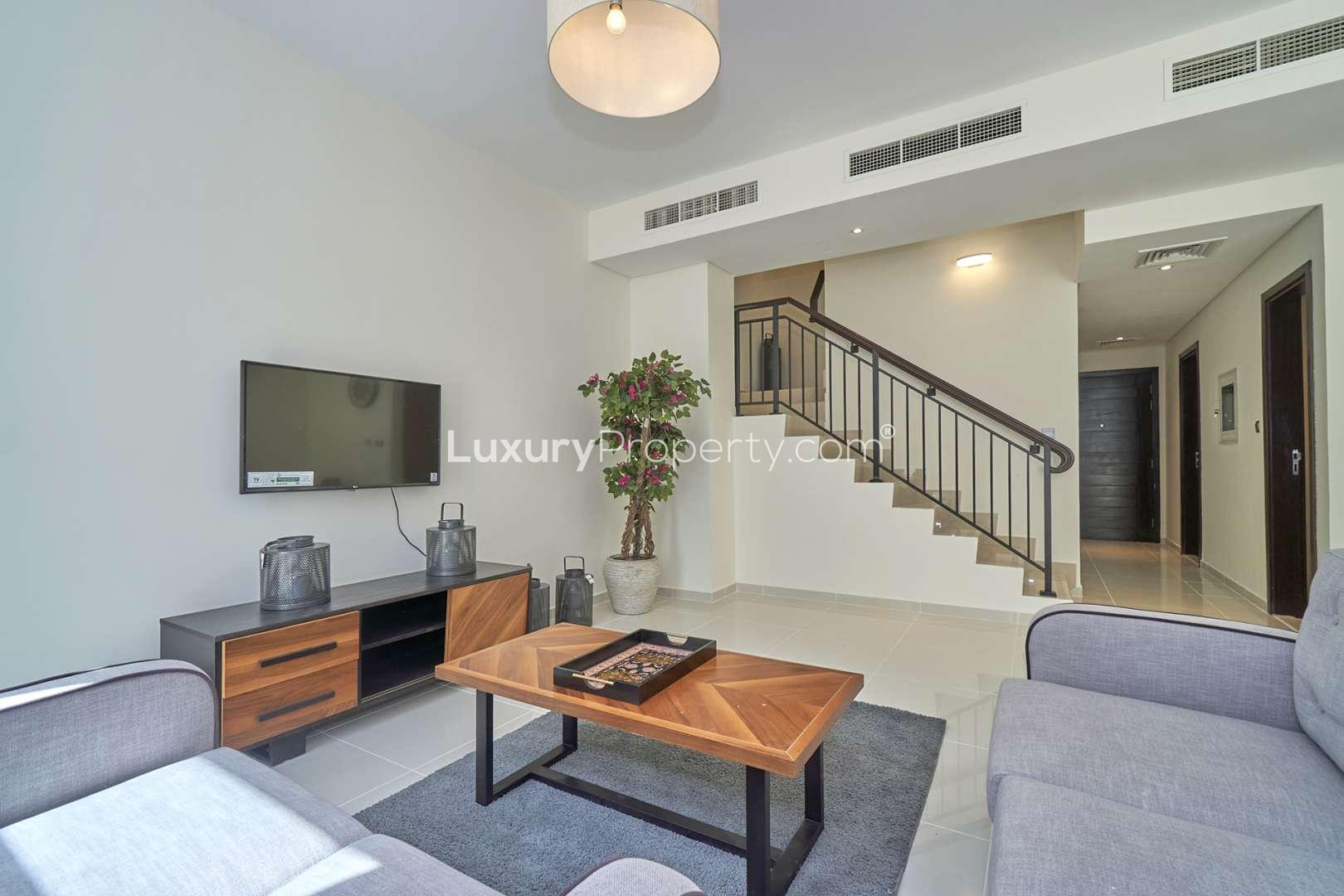 Fully furnished living room in 3-bedroom townhouse, Pacifica, Akoya by DAMAC Hills 2