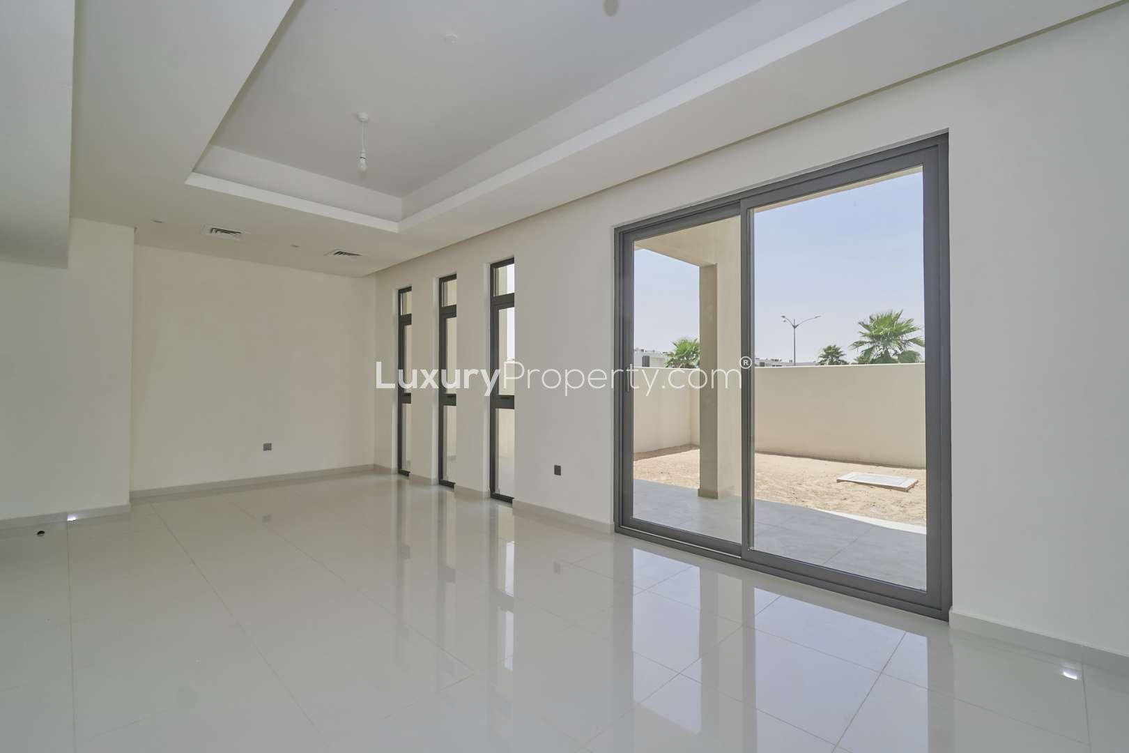 Modern 3-bedroom townhouse exterior in Primrose, Damac Hills 2, with balcony views